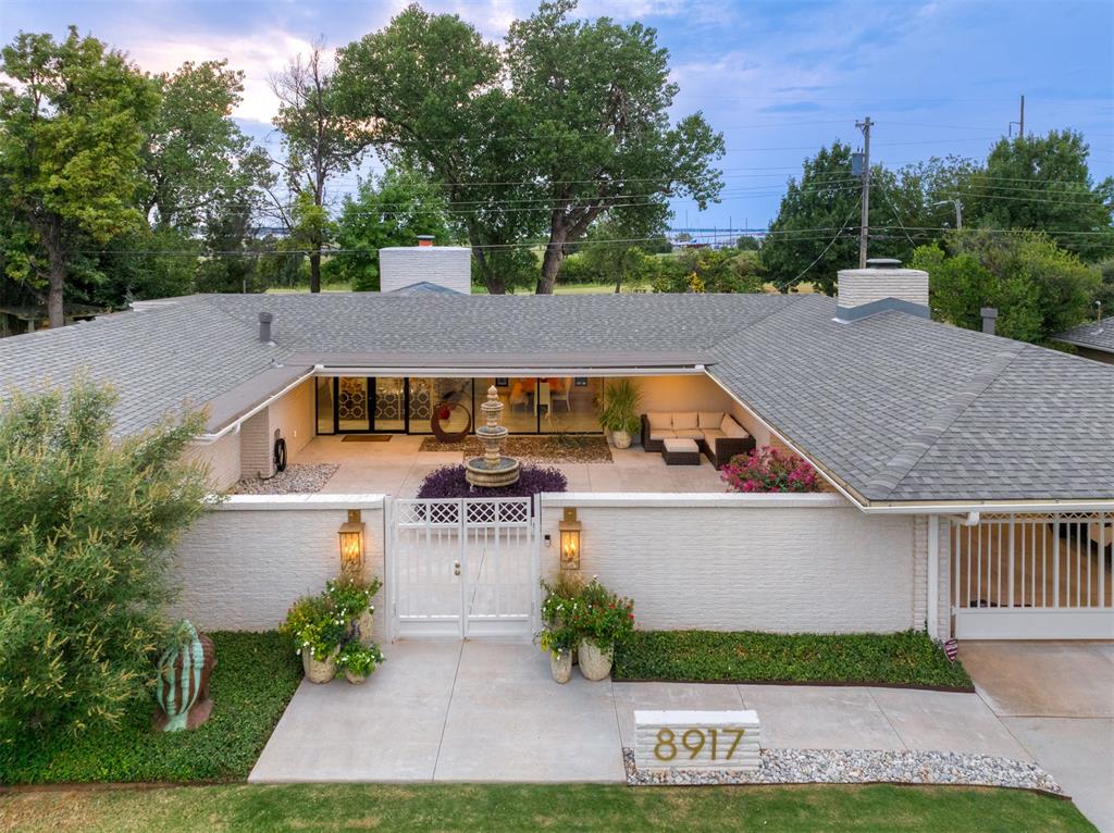 Step into this one-of-a-kind mid-century modern masterpiece that feels straight out of Palm Springs. Completely renovated down to the studs, this home blends timeless architecture with today’s luxury finishes. Nestled in the highly sought-after Lakehurst neighborhood, it backs directly to an 80-acre greenbelt with sweeping views of Lake Hefner. Enjoy the serene private courtyard, where an elegant water fountain creates a peaceful focal point and sets the tone for resort-style living. Inside, every detail has been thoughtfully designed to capture light, flow, and elegance. Perfectly situated near the city’s best shopping and restaurants, this home offers both tranquility and convenience—an unmatched lifestyle in the heart of OKC.