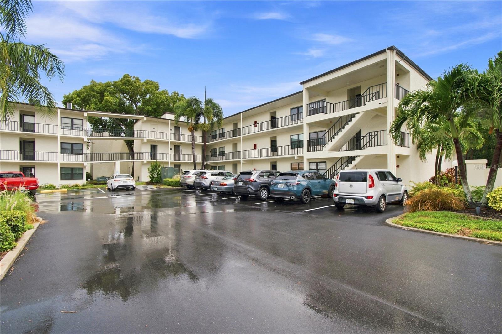 Welcome to Lakeview of Largo — Comfort, Style & Resort-Style Living!!! Step into comfort and style in this beautifully updated, spacious 2-bedroom, 2-bathroom condo located in the desirable 55+ community of Lakeview of Largo. Offering approximately 1,080 square feet of living space, this turnkey residence combines thoughtful updates, abundant natural light, and a serene waterfront setting. One of the home's standout features is the impressive double 28-foot enclosed patio, surrounded by floor-to-ceiling windows and equipped with automatic hurricane shutters. Overlooking a picturesque pond with a fountain, the patio provides a peaceful retreat where you can enjoy morning coffee, unwind at the end of the day, and take in the abundant wildlife and tranquil views. Inside, the open-concept layout creates a bright and welcoming atmosphere. The updated kitchen features white shaker-style cabinetry, stainless steel appliances, granite countertops, a breakfast bar, breakfast nook, and dedicated coffee station—providing both style and functionality for everyday living and entertaining. Both bathrooms have been thoughtfully updated with newer vanities and coordinating granite countertops. The spacious living and dining areas, along with the primary bedroom, feature durable luxury vinyl plank flooring, while tile flooring is featured in the kitchen, bathrooms, and second bedroom. The versatile second bedroom is currently being used as an office, offering flexibility to accommodate your lifestyle and needs. The spacious primary suite includes a generous walk-in closet, while newer light fixtures and ceiling fans throughout the home add a modern finishing touch. The HVAC system was replaced in 2024. For added convenience, the building offers two laundry rooms on each floor, making laundry access easy and accessible. Lakeview of Largo is a well-maintained 55+ community designed for an active, maintenance-free lifestyle. Residents enjoy an array of resort-style amenities, including two swimming pools, one heated pool, a vibrant clubhouse, shuffleboard courts, and a full calendar of social activities and events. The location is equally impressive. Situated approximately one mile from the Gulf beaches, you'll have easy access to beautiful sandy shores for swimming, sunbathing, and leisurely walks. Nearby you'll also find an excellent selection of restaurants, golf courses, nature preserves, cultural attractions, healthcare services, and public transportation, providing convenience and recreation just minutes from home. The HOA fee includes water, sewer, trash, and cable, adding even more value and convenience.This updated, turnkey condo offers the perfect combination of comfort, convenience, waterfront tranquility, community amenities, and an exceptional location near the Gulf beaches. Don't miss the opportunity to make this inviting Lakeview of Largo residence your new home.