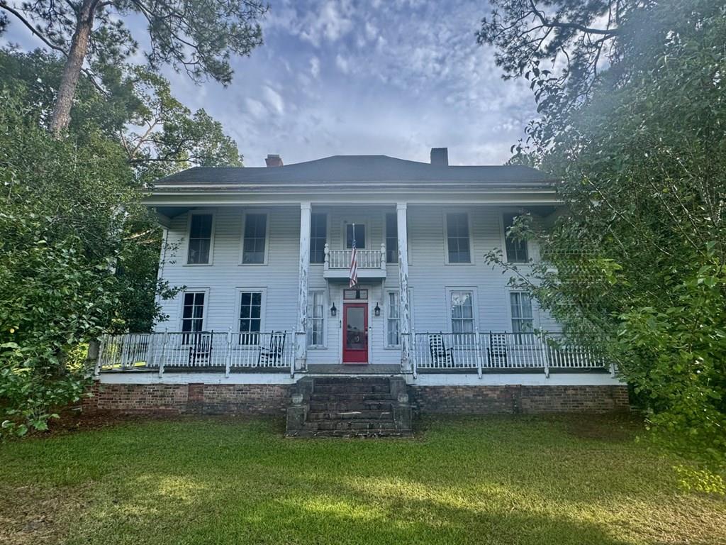 Discover this historic antebellum residence nestled in the charming town of Cairo, Georgia, conveniently located near schools and shopping. This beautifully updated and remodeled home seamlessly blends timeless Southern charm with modern upgrades! Features include: 6 spacious bedrooms and 2.5 bathrooms, including a luxurious primary bathroom with a Jacuzzi tub and walk-in shower Professionally refinished hardwood floors throughout the main living areas and newer carpet in the bedrooms. Kitchen is renovated with ample cabinet space, a cooktop, garbage disposal, 5 stage osmosis water filtration system and an eat-in bar—perfect for casual dining. Formal dining room, inviting living room, and a cozy den, offering plenty of space for family gatherings and entertaining Additional lot included, totaling approximately 1.19 acres. Lush landscape featuring pear, fig, muscadine grapes, azaleas, crepe myrtles, gardenias, and camellias. While the exterior may need a little TLC, but interior is phenomenal. The home boasts nearly 4,000 sq. ft. of impressive living space. Don't miss this exceptional opportunity to own a stunning historic antebellum home—perfect as a primary residence or a charming bed-and-breakfast.