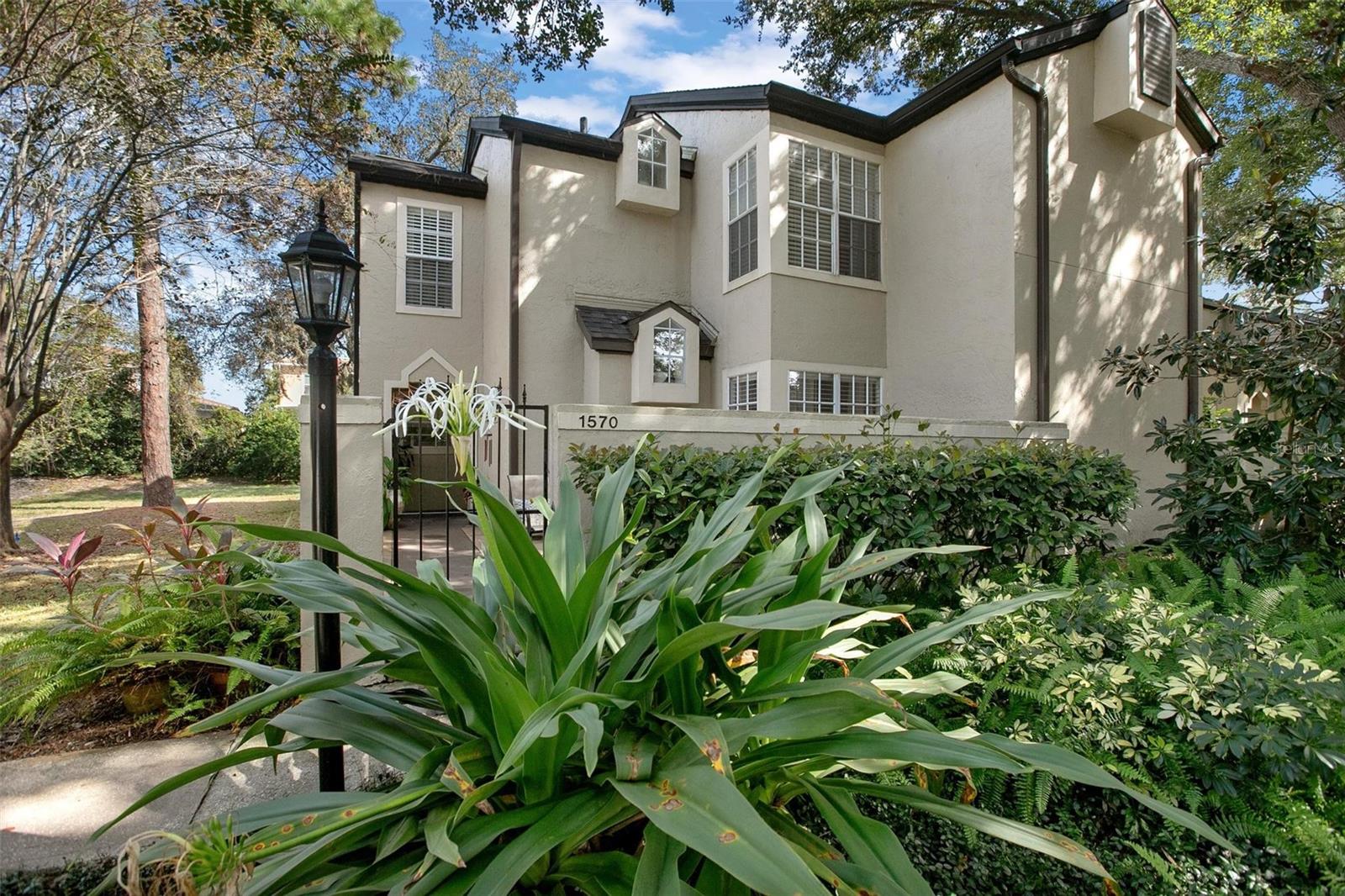 Tucked inside the gated community of Barclay Place at Heathrow, this elegantly updated end-unit townhouse-style condo pairs quiet privacy with a modern, easygoing layout. The main living area opens under dramatic vaulted ceilings, grounded by a wood-burning fireplace and a convenient breakfast bar that connects the kitchen to the action. Two true primary suites resulting in flexible living—one on the first floor, with new LVP flooring, a stylish barn door, and a contemporary tiled shower; the second upstairs with a nearby loft/den that can readily function as a third bedroom with closet. Thoughtful finishes elevate the everyday: granite countertops in the kitchen and baths, stainless steel appliances, and crisp, cohesive design throughout. Outdoor spaces are a highlight—there’s a screened rear patio with no neighbors behind for peaceful mornings, plus a private front courtyard perfect for mingling or winding down after the day. Major exterior items were handled in April 2023, including a new roof, fresh paint, and updated gutters, adding confidence to the curb appeal. LVP added through out November 2025. Community perks sit right where you want them—the pool and clubhouse are just across the street, with tennis courts moments away. For anyone seeking polished, low-maintenance living in a premier Heathrow address, this home delivers. Book a showing and see how comfortably it fits your life.