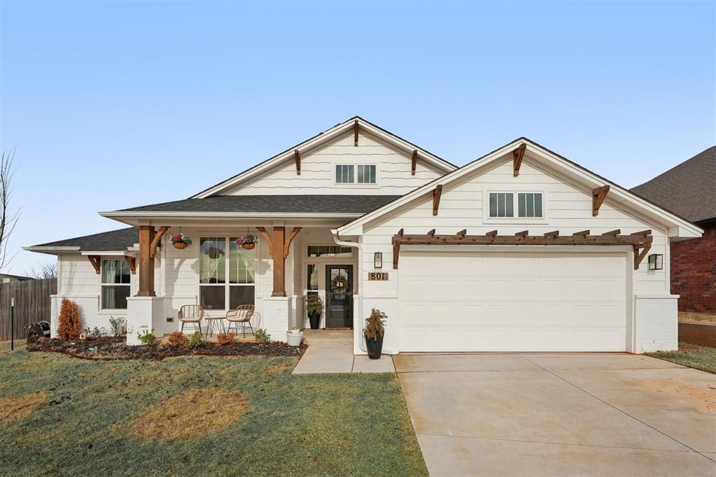 Stunning modern farmhouse built in 2023, offering 4 bedrooms, 2.5 baths, and 2,641 square feet in the Norman School District. This home is filled with natural light and showcases wood-look tile flooring throughout, creating a cohesive, warm, and low-maintenance living space.The open living area features custom built-ins and floating shelves, a beautiful fireplace, and an inviting layout ideal for both everyday living and entertaining. The thoughtfully designed floor plan includes a dedicated office/study and/or media room, providing flexible space for work or relaxation.Bedrooms feature custom built-ins, and the home is equipped with a central vacuum system for added convenience. The welcoming entry, modern lighting, and clean architectural lines highlight the home’s farmhouse charm throughout.Enjoy outdoor living on the covered back patio with fireplace, perfect for entertaining year-round. With modern finishes, functional design, and exceptional curb appeal, this home offers comfort, style, and versatility in one of Norman’s desirable areas.