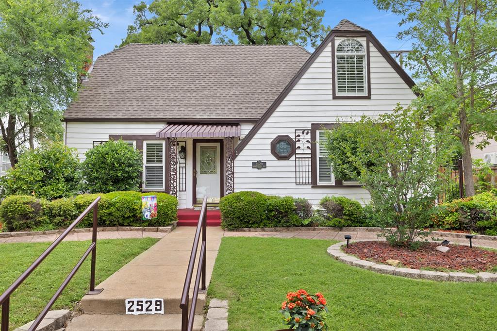 Nestled in the heart of Fort Worth's historic Oakhurst neighborhood—a 1920s-era gem renowned for its safe, quiet streets, mature trees, & vibrant community spirit. Honored as Fort Worth's Neighborhood of the Year in 2006 & 2010, Oakhurst offers an active neighborhood association with annual events that celebrate its rich history & unique character. Just a block from Oakhurst Park and minutes from downtown Fort Worth, this property provides effortless access to urban amenities while embracing a serene suburban feel. Plus, its prime location puts you steps away from the expansive Trinity Trails system—over 100 miles of scenic paths for walking, biking, & running along the Trinity River, with a nearby trailhead on Oakhurst Scenic Drive.

Step inside to find fresh paint & beautifully restored hardwood floors that infuse warmth and elegance throughout the 1,598 sq ft main house. Featuring two spacious bedrooms & two full baths, this inviting residence includes a light-filled sunroom adjacent to the dining room & kitchen, perfect for morning coffee or casual gatherings. Modern conveniences abound, with a wood-burning fireplace & ceiling fans.
But the true standout features lie in the expansive 0.25-acre lot: a detached garage boasting an upstairs studio apartment—complete with its own private bathroom & kitchenette, ideal for guests, a home office, or rental potential as an accessory dwelling unit. In the backyard, discover an extra shop equipped with three car garage doors, offering ample space for hobbies, storage, or projects, alongside an RV port & additional parking for boats, vehicles, or recreational gear. With a total of four garage spaces, & RV-boat storage, this property caters to car enthusiasts, adventurers, & those seeking versatile outdoor options.  This Oakhurst treasure combines historic appeal with modern updates & exceptional amenities, making it a gateway to the best of Fort Worth living. Don't miss your chance to call it home!