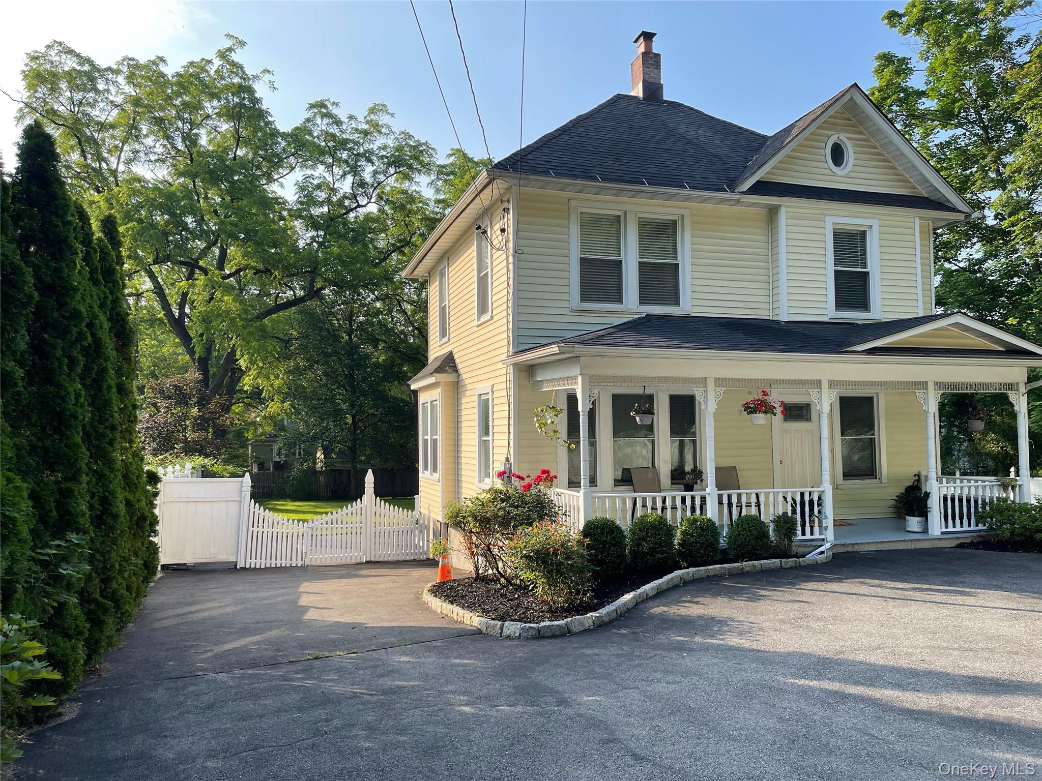 Welcome home to this well-maintained residence in the heart of vibrant Chappaqua! This 4 bedroom and 2.5 full bathroom house is located in the award-winning Chappaqua school district. Step inside to discover gleaming hardwood floors throughout, a cozy living room with a wood-burning fireplace, and a bright, charming dining room. The kitchen features ample cabinetry, granite countertops, and brand-new stainless-steel appliances. The spacious primary suite, versatile enough to serve as a large family room, includes a walk-in closet and a newly renovated en-suite bathroom. Upstairs, three generously sized bedrooms await, including a second primary suite with a walk-in closet, and a second full bathroom. Additional highlights include a welcoming front porch, expansive attic storage, a full basement with crawl space, and a circular driveway accommodating up to six cars for effortless access. Enjoy summer days in the fenced backyard—perfect for gatherings, gardening, or basking in the sunshine. This prime location is minutes from the Train Station, library, town hall, post office, shops, restaurants, top-rated schools, and easy access to major parkways.Zoned for versatility, this property offers a potential for conversion back to commercial use, for an attorney’s office, dental practice, or other professional ventures in the bustling heart of Chappaqua. Don’t miss your chance to own this delightful home with endless possibilities! The house is no longer furnished as shown in the photos.