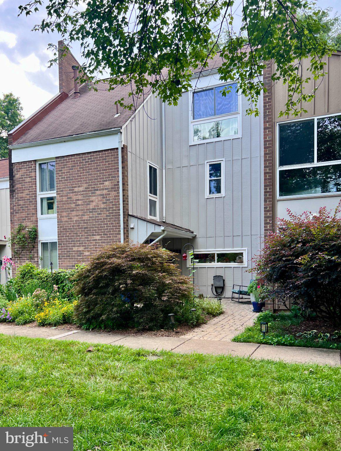 Spacious Renovated Townhome Backing to Golf Course & RA Trail - walkable to Lake Anne and Reston Town Center. ** Live on the 9th fairway of the golf course. ** Front patio and gardens lead into the foyer which has 12x12 Saltillo-style Tile floor into the fully renovated kitchen. An open floor plan leads from the kitchen to the bright dining room with skylights and opens to a large patio with storage shed and out to a Reston Association pathway. ** Gas fireplace in living room has a beautiful Travertine mantle surround. ** 2nd floor has 3 bedrooms and 2 updated full bathrooms. ** 3rd floor has the 4th bedroom or whatever you imagine it to be. With east and west facing walls of windows, it has been an artist studio in the past. Cathedral ceiling, one full brick wall, walk-in closet, large updated bathroom with walk-in shower, AND a deck overlooking trees and the golf course. ** New Roof - August 2026 has a one-year transferable warranty on labor and installation.