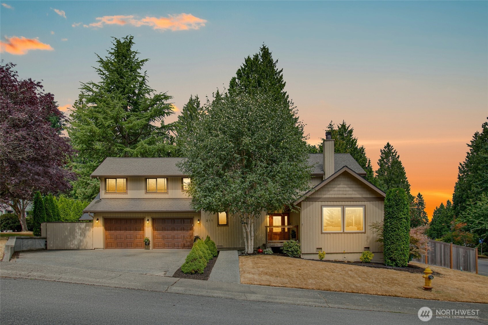 Bright, spacious, and packed with upgrades! This 3 bed/3.25 bath Northshore SD home wows with vaulted ceilings, wood beams, hardwoods, and walls of windows. Brand-new kitchen, all refreshed baths, updated lighting, new windows, and outlets. Separate-entry MIL/guest suite or office above the garage with full kitchen, updated ¾ bath & huge 400SF covered cedar deck. Huge split-level fully fenced, sunny yard with playhouse, garden shed, and room to run & play. Large corner lot on a quiet dead-end offers privacy and function, close to nearby trails. A/C, tankless water heater, Reznor furnace, new washer/dryer, deep garage w/heater, security system, and wired for generator & hot tub. Great location close to freeways. No HOA—move right in!