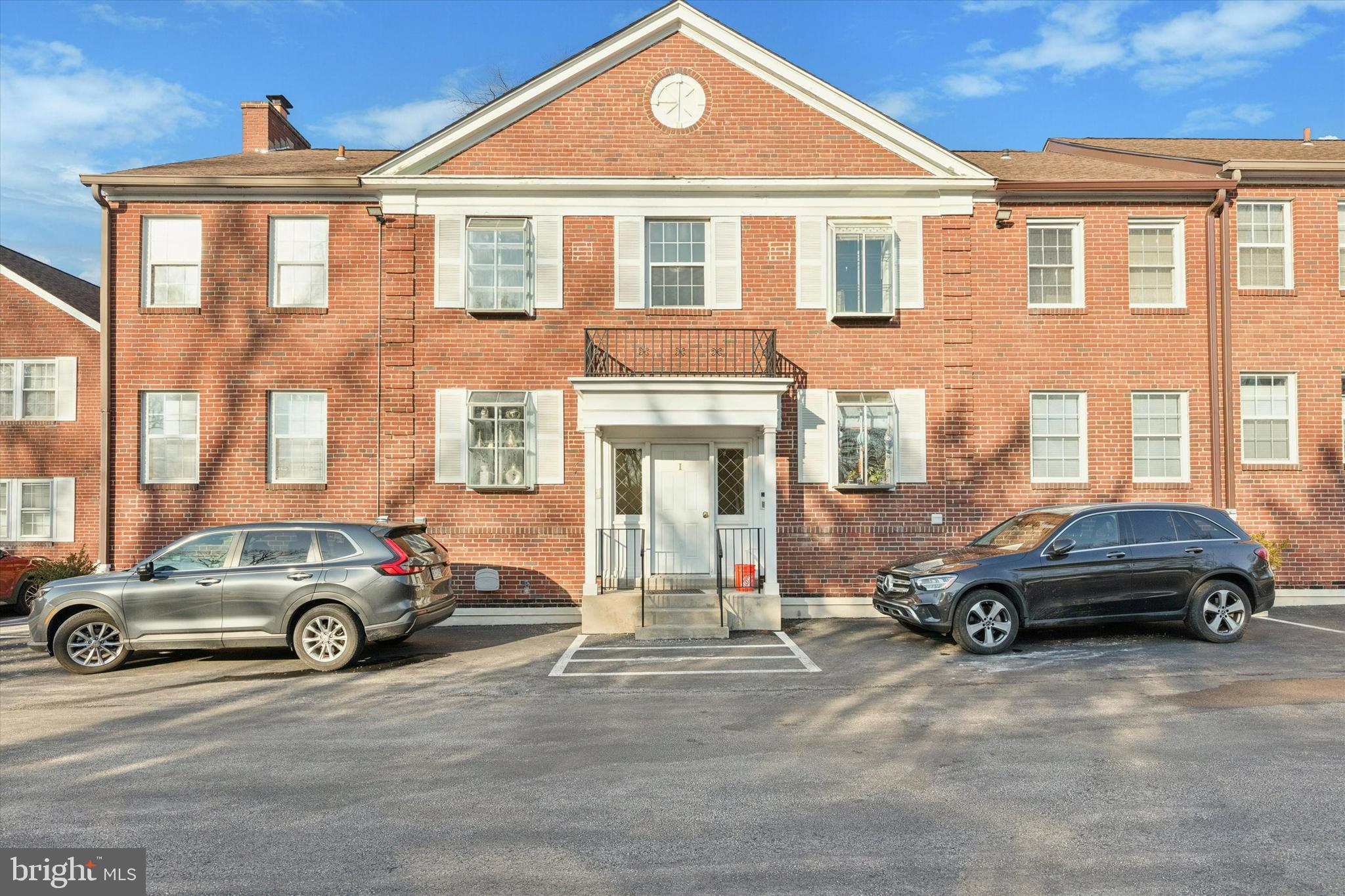 Welcome to Mayflower Square, offering convenient and carefree living on the Main Line within the award-winning Lower Merion School District. This spacious first-floor condo features 2 bedrooms and 1.5 baths with a thoughtfully designed layout that includes a combined living and dining area, along with an additional nook ideal for a sitting area or home office. The naturally bright kitchen was renovated in 2018 and offers granite countertops, solid oak cabinetry, ceramic tile flooring, a dishwasher, and garbage disposal. Just off the dining area, a sun-filled tiled sunroom provides abundant natural light and peaceful views of the grassy courtyard, along with a secondary doorway offering direct courtyard access. The primary bedroom features a recently updated full bath with new flooring, vanity, faucet, and toilet, while the guest bedroom enjoys convenient access to the powder room. A newer stackable washer and dryer (2020) are located within the unit. Additional storage is available in a dedicated basement storage unit (#12). The unit also includes one assigned underground garage parking space, with ample guest parking available. The HOA supports low-maintenance living and covers common area maintenance, trash, water, sewer, and snow removal. Ideally located in sought-after Bryn Mawr, the community is just minutes from Ashbridge and Rosemont Parks, Lancaster Avenue shops and restaurants, and within walking distance to the Rosemont and Bryn Mawr train stations, as well as nearby bus routes—offering excellent access throughout the Main Line and beyond. Convenient to Villanova University and major roadways. The community is nearing its rental capacity, presenting a timely opportunity for investors. The property is currently tenant-occupied with a lease in place through March 31, 2026; the tenant is willing to stay.