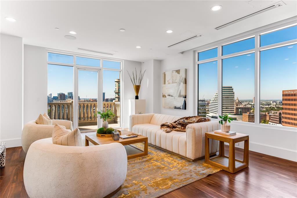 A stunning two-story penthouse residence commanding over 6,600 square feet of meticulously renovated urban sophistication in one of Dallas's most coveted Turtle Creek high-rise addresses. Direct elevator access opens directly onto both floors of this custom contemporary residence, where custom walnut floors and intricate African Sapele mahogany paneling create an atmosphere of refined elegance. The expansive primary suite features a private terrace with breathtaking downtown skyline vistas, while flexible living spaces flow seamlessly for both intimate gatherings and grand entertaining. An impressive 2,200-bottle wine room anchors the home's entertaining capabilities, complemented by a chef's kitchen appointed with Calcutta stone countertops, SubZero refrigeration, and Wolf commercial-grade appliances. Four generous parking spaces and dual storage units complete this exceptional offering in the heart of Turtle Creek's prestigious corridor.