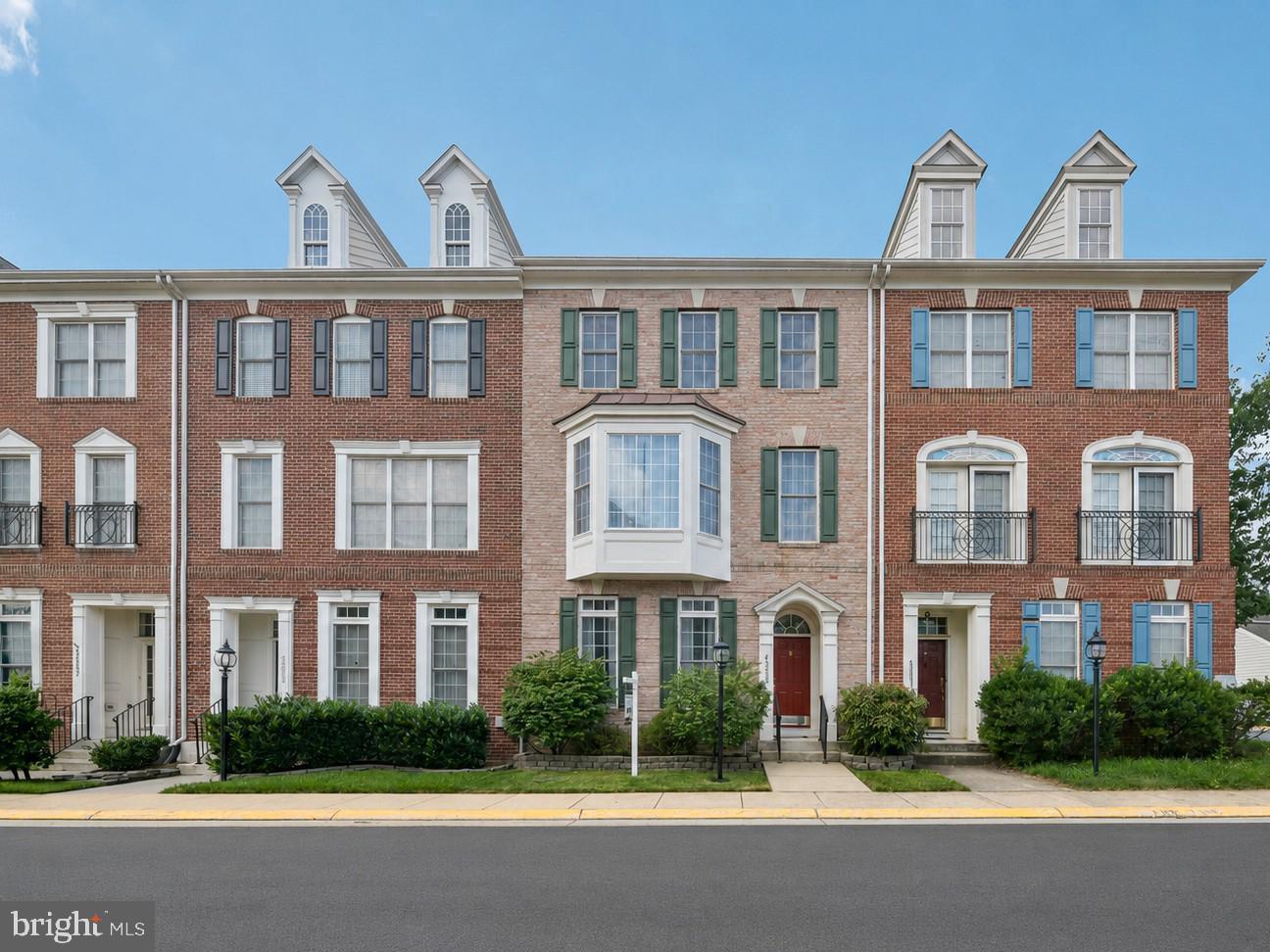 This beautifully maintained 3 level townhome offers spacious living, a flexible floorplan and an exceptional location in the highly desirable Brambleton community. The main level features multiple living and dining spaces with crown molding and chair rail trim, along with a spacious kitchen featuring quartz countertops, center island, tile backsplash, separate pantry and breakfast nook. The kitchen opens to a comfortable gathering area with gas fireplace and provides direct access to the private rear courtyard. The fenced courtyard is beautifully landscaped with a paver patio and creates a wonderful outdoor space between the home and the large detached 2 car garage with EV charger hookup.The second level features a spacious primary suite with double-door entry, bay window sitting area, two walk-in closets and a large primary bath with dual sinks, separate shower, soaking tub and private water closet. Down the hall is a generously sized flex room, perfect for a home office, den or a possible 4th bedroom.  A conveniently located laundry area completes this level.The third level provides even more flexible living space with an expansive loft-style family room, ideal for a media room, homework area, playroom, or second home office. Two additional spacious bedrooms and a full hall bath complete this level.Enjoy access to more than 250 acres of common green space, community pools, miles of trails, parks, playgrounds, and an impressive array of neighborhood amenities. Brambleton Town Center is just moments away, offering restaurants, coffee shops, grocery shopping, a movie theater, and everyday conveniences, while nearby Legacy Park provides even more opportunities to enjoy the outdoors. Commuters will appreciate easy access to Loudoun County Parkway, the Dulles Greenway, and Washington Dulles International Airport.