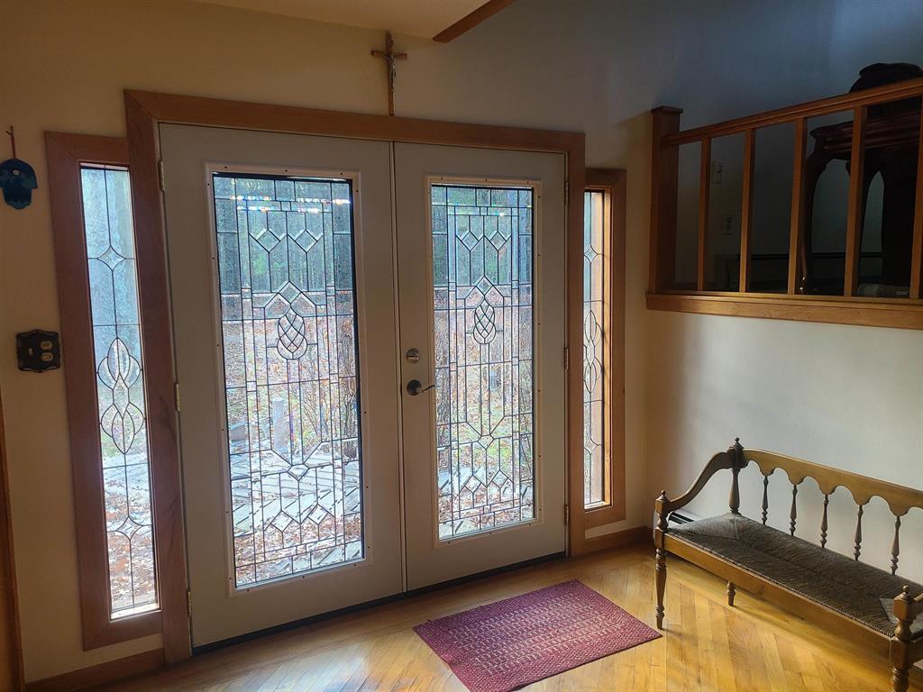 This unique one of a kind 5.22 acre property is a dream! The Multi-level 2,352 sq ft house features 2 fireplaces, 3 spacious bedrooms and 2 and half baths, as well as hardwood floors and carpet throughout the house. There is storage galore between, the 2 car garage and the 40x24 pole barn, adjacent to the pole barn is a 40x10 workshop/storage area. Pole barn features a wood burner for a heating source. Gorgeous mature hardwood and pines make up most of the 5.22 acres, the back line of property is adjacent to state land. There are two 1,000 ft wells, one for the house and the other for the 6 zone sprinkler system. In addition to the natural gas boiler system, there is a wood burner you can choose to heat the house with. Close to public access for Van Etten Lake, and a short distance to both Cedar Lake and Lake Huron. All of this and close proximity to town, for easy access to restaurants and shopping. You don't want to miss out on this beauty!