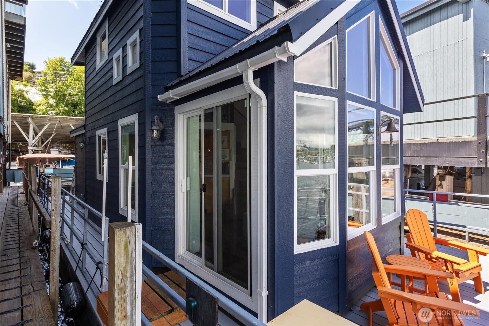 Live the Lake Union lifestyle at Rainier Marina in this charming 51' x 18' floating home offering approximately 490 square feet of thoughtfully designed living space. Filled with natural light and full of character, this unique houseboat delivers a peaceful waterfront retreat just minutes from the heart of Seattle.  The open living area makes efficient use of every square foot, while the spacious loft provides the perfect home office, reading nook, or extra sleeping space for guests. Whether you're looking for a full-time residence or a weekend getaway, the flexible layout adapts to your lifestyle.  Step outside to the walk-around deck and immerse yourself in everything that makes life on the water so special. Enjoy your morning coffee with tranquil lake views, entertain friends in the fresh air, or unwind as the sun sets over Lake Union.  Perfectly located at Rainier Marina, you'll enjoy easy access to Seattle's restaurants, parks, and vibrant waterfront while coming home to a one-of-a-kind floating retreat. If you've dreamed of simplifying life without sacrificing character or location, this is your opportunity to make Lake Union your backyard.
