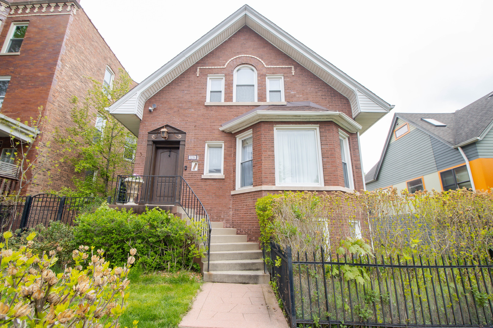 Discover your dream home in the vibrant Logan Square neighborhood, perfectly positioned on a spacious double lot. This stunning residence offers 6 bedrooms and 2.1 bathrooms, providing ample space. The open and airy living and dining areas are bathed in natural light, creating a welcoming ambiance for gatherings and daily living.  Experience the elegance of cathedral ceilings on the second floor, enhancing the feeling of space and luxury. The high-ceilinged basement awaits your personal touch, offering endless possibilities for customization-whether it be a home gym, entertainment area, or additional living space. Step outside to enjoy a beautifully landscaped backyard, complete with lush greenery and shrubs, ideal for relaxation and outdoor activities. With a two-car garage and an extra outdoor parking space, convenience is at your doorstep. Make it yours today!