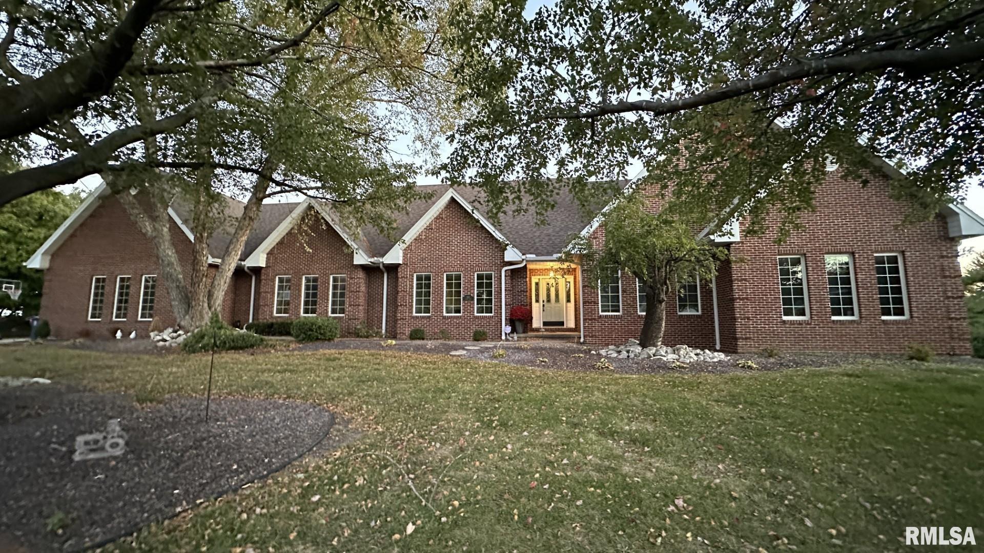 Welcome to 921 Birdie Lane in Quincy, IL — a luxury 5-bed, 3.5-bath ranch offering nearly 6,000 sq ft of finished living space on almost 1 acre in the Spring Lake subdivision. The state-of-the-art primary suite includes a soaking tub, stand-under shower, and a 12×13 walk-in closet with island storage. The chef’s kitchen features granite countertops, a large island, induction cooktop, double wall ovens, and two walk-in pantries—ideal for cooking or entertaining. Enjoy cathedral ceilings, abundant natural light, two fireplaces, and a fully finished walk-out basement with bonus 13×15 garage for golf cart or storage. Recent updates include new flooring, fresh paint, and updated fixtures (2023), plus a complete roof tear-off (2022). Move-in ready with 3D walkthrough, video tour, and floor plan available—experience the quality, space, and luxury this home offers.