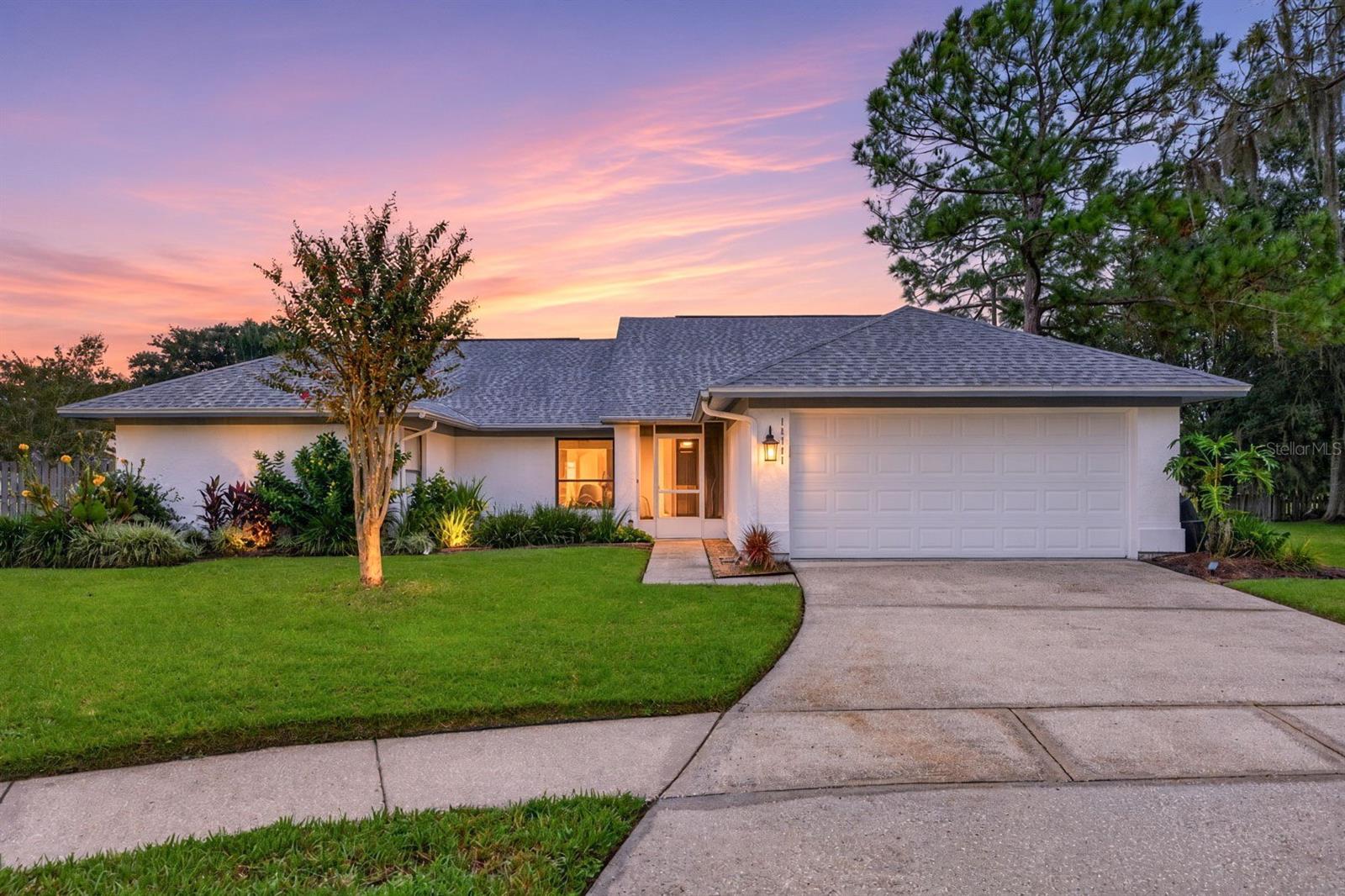 Welcome to this charming 3-bedroom, 2-bath home tucked away on a quiet cul-de-sac and situated on one of the largest lots in Pebble Creek! With a spacious, thoughtfully designed floor plan, an incredible backyard, newer roof (2022), this home offers plenty of room for both everyday living and entertaining. The split-bedroom layout provides privacy, with the primary suite located on one side of the home. The generously sized primary bedroom features an en-suite bath with dual sinks, a walk-in shower, a soaking tub and two walk-in closets. Two additional bedrooms are located on the opposite side of the home and share a full bath. Multiple living spaces include a formal living room and diningroom, along with a spacious family room perfect for gathering and entertaining. Centrally located, the kitchen overlooks the family room and offers beautiful views of the expansive backyard. Sliding glass doors open to a large, screened lanai featuring plenty of covered space for outdoor dining and lounging. Beyond the lanai is a huge, fenced backyard with endless possibilities for entertaining, pets, play or simply relaxing outdoors. Pebble Creek is an established New Tampa community offering wonderful amenities, including a community pool, tennis courts, playgrounds and a community center. Conveniently located near I-75, I-4 and I-275, the home provides easy access to everything New Tampa and Wesley Chapel have waiting for you. Enjoy nearby dining and shopping at The Shops at Wiregrass and Tampa Premium Outlets, miles of running and biking trails at Flatwoods, AdventHealth Center Ice, and convenient access to AdventHealth, BayCare, Moffitt Cancer Center and the upcoming Johns Hopkins Hospital campus.