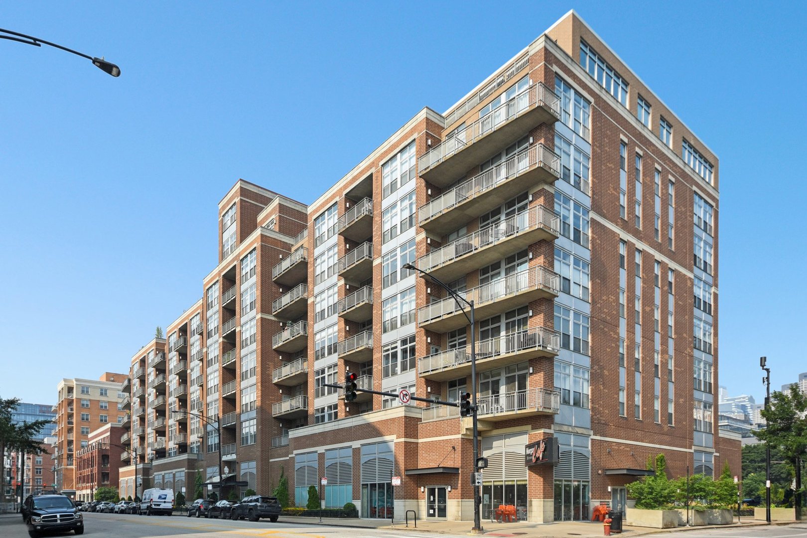 Fully Upgraded 2 Bed / 2 Bath Corner Unit in West Loop with Two Deeded Parking Spots  Welcome to Unit 825 at 111 S. Morgan - a bright, east-facing corner condo with a true 2-bedroom layout (loft enclosed in 2025), a custom bar/coffee nook (added in 2025), and a private 34-foot balcony with weatherproof tile and turf (2025).    Inside you'll find a spacious open layout with hardwood floors, brand new fridge and dishwasher (2025), granite countertops, a kitchen island, and in-unit washer/dryer (2022). The primary bedroom includes dual custom closets with upgraded systems, new flooring (2022), and automatic blackout blinds. The entire unit was freshly painted in 2022 and includes a smart front door lock.    Two side-by-side heated garage parking spots must be purchased with the unit at $25K each.    Building Info: Renovated lobby and mail/package room (2025), new roof (2023), 24-hour door staff, bike room, freight elevator, on-site maintenance. HOA includes cable & fiber internet.    Unbeatable location - steps to Mary Bartelme Park, Skinner Park, Randolph Street, Fulton Market, and quick access to I-90/94 & I-290.