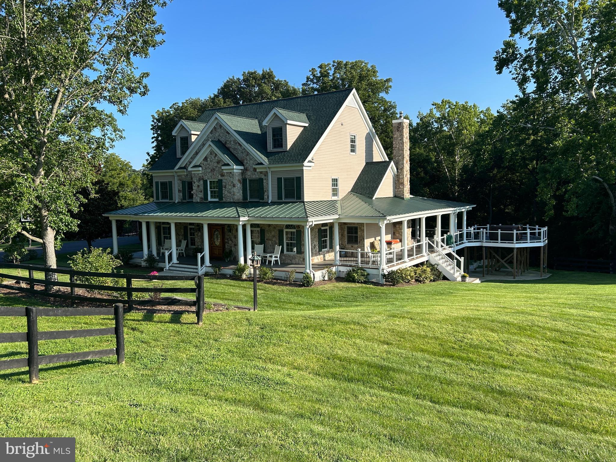 Experience one of Loudoun County's most extraordinary private country estates, where luxury living meets the timeless beauty of Catoctin Creek. Perfectly positioned in a serene setting surrounded by mature shade trees, this remarkable property offers exceptional privacy, breathtaking creekfront views, and an unmatched lifestyle just minutes from the conveniences of Purcellville.The estate's defining feature is its commanding overlook of the peaceful waters of Catoctin Creek, one of Northern Virginia's most picturesque waterways. A private bridge crosses the creek at a beautiful stretch of natural rapids, creating a stunning centerpiece and filling the property with the soothing sounds of flowing water. Multiple fire pit gathering areas nestled along the creek invite memorable evenings with family and friends while providing an intimate connection to the surrounding landscape.Designed for equestrian enthusiasts, hobby farmers, or anyone seeking open space, the property features several fenced paddocks ideal for horses, cattle, or other livestock. A beautifully appointed barn includes four spacious stalls, a tack room, and an attached garage, offering outstanding functionality while complementing the property's classic Virginia character. Gardeners will appreciate the expansive fenced garden complete with power and irrigation, providing ample room for vegetables, flowers, and seasonal harvests.Outdoor living is simply unparalleled. The expansive wraparound porch offers spectacular, close-up views of Catoctin Creek from nearly every angle. A Jacuzzi hot tub perch overlooks the water, creating the perfect place to relax while listening to the gentle sounds of the creek. The porch and surrounding outdoor spaces were thoughtfully designed in anticipation of a future private inground pool, making the property even more ideal for entertaining and family fun.Inside, the home blends elegance with comfort. The gourmet kitchen serves as the heart of the residence and opens to gracious gathering spaces that include formal living and dining rooms, along with a welcoming family room—perfectly suited for both intimate family life and large-scale entertaining.The luxurious primary suite offers a peaceful retreat featuring a beautifully renovated spa-inspired bathroom with a Jacuzzi soaking tub and two generous walk-in closets. Two additional bedrooms are connected by a completely renovated Jack-and-Jill bathroom, while the third floor provides exceptional flexibility with a spacious bedroom featuring a large closet and a separate private office—ideal for remote work, creative pursuits, or guest accommodations.The fully finished lower level is perfectly configured for multigenerational living or extended guest stays, offering an additional bedroom, full bathroom, expansive entertainment and recreation area, and two generous storage rooms.Nature flourishes throughout the estate. Frequent visitors include white-tailed deer, foxes, great blue herons, wild turkeys, turtles, ducks, geese, and countless songbirds, creating a peaceful sanctuary where every season brings new beauty and abundant wildlife.Modern infrastructure complements the property's timeless appeal. The electrical system is wired for a whole-home standby generator, providing peace of mind during power outages, while high-speed Xfinity broadband internet supports today's connected lifestyle with excellent service for remote work, streaming, and smart-home technology.Despite its remarkable privacy, the estate is exceptionally convenient. Located just minutes to Rt. 7and the charming shops, restaurants, wineries, and breweries of historic Purcellville and less than thirty minutes from Washington Dulles International Airport.38303 Winsome Trail Lane is more than a home—it is a legacy property where luxury, nature, equestrian living, and one of the most spectacular creekfront settings in Loudoun County come together to create an unparalleled Virginia country estate.