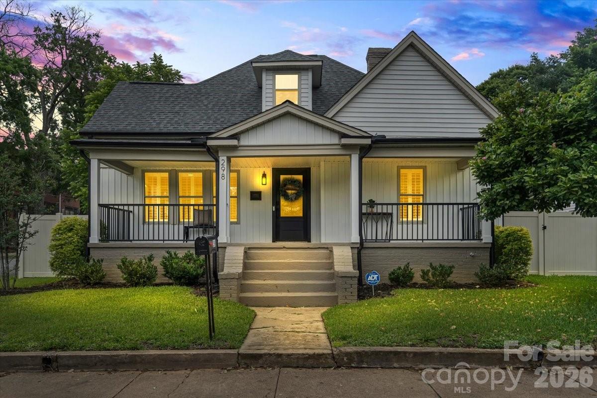 Welcome to 298 Kerr Street, where timeless charm meets an incredible renovation in the heart of Gibson Village! Situated on a corner lot just minutes from Gibson Mill & downtown Concord, this beautifully updated home features an open floor plan w/ 3 bedrooms, 2 bathrooms, a versatile loft/bonus space, soaring ceilings, & thoughtfully designed living spaces throughout. The designer kitchen is truly the center of the home, featuring a 36" six-burner gas range, pot filler, farmhouse sink, quartz countertops, custom hood, tile backsplash, under-cabinet lighting, premium appliances, & abundant cabinet space. Just off the kitchen, the mudroom w/ built-in bench creates the perfect everyday drop zone. The main-level primary suite offers a walk-in closet & beautifully updated bath w/ marble tile flooring and shower surround. Additional features include luxury vinyl plank flooring, plantation shutters, recessed lighting, designer fixtures, & ample storage throughout. Enjoy outdoor living from the covered front porch, expansive rear patio, & fully fenced backyard w/ gate. The carport & workshop provide additional space for storage, hobbies, or projects. Extensive improvements include updated electrical, plumbing, windows, insulation, ductwork, tankless WH, roof, and more. A RARE opportunity to own a beautifully reimagined home in one of Concord's most convenient locations!