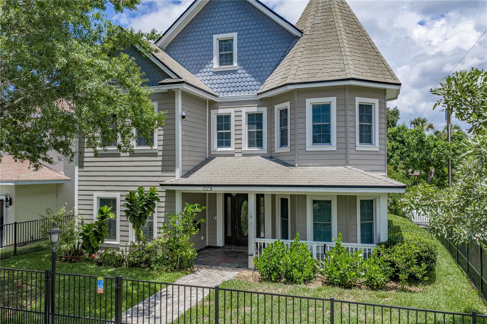Absolutely stunning 3 story, 4BR/3.5BA corner home located in South Tampa’s Palma Ceia neighborhood, just blocks from Palma Ceia Country Club and Bayshore Blvd. Built with 7.75” thick Insulated Concrete Forms (ICF) and reinforced with #5 rebar both horizontally and vertically every 24”. The exterior is covered in Hardie board siding that is both rot-resistant and self-extinguishing with all facia and trim boards made from MiraTEC hybrid wood material. The windows are Simonton Stormbreaker Plus hurricane impact rated up to 140mph. Upon entry, you will find beautiful solid Brazilian cherry wood floors throughout the entire first floor, third floor, and part of the second floor. To the right is the living room, showered with natural light! To your left is the dining room which seamlessly flows into the spacious kitchen, making an impressive space for those holiday get-togethers with family and friends. The kitchen, including the island, features gorgeous granite counters. Tons of additional custom made solid maple cabinetry, a wine fridge and built-in wine rack, 6 burner Dacor gas range, plus GE Monogram built-in stainless oven and microwave, refrigerator, and vent hood gives the kitchen a grand feel. Around the corner is the media room, a welcoming environment suitable for spending time with your family, and a half bath. The second level includes three bedrooms, a gym, and the laundry room. One bedroom is flooded with natural light and features an oversized walk-in closet with custom built-ins as well as an En Suite with a dual sink vanity and large walk-in tiled shower. The two additional bedrooms  are connected via a Jack and Jill bathroom that includes a generous dual sink vanity and glass shower. One bedroom includes a Murphy bed cabinet. The laundry room includes a stainless wash sink and laundry chute from the Primary bedroom upstairs. The gym has been equipped with a padded floor for comfortable workouts! (This could easily be utilized as an office or even a playroom.) Also located on the 2nd level is an enclosed balcony with a water supply and drain and an enormous storage room under the stairwell. Moving up to the 3rd level finds your oasis, the Primary bedroom. Unique built-in features define this space including two window boxes and built-in shelving. The En Suite will take your breath away boasting TWO ample walk-in closets with custom built-in organization, a contemporary freestanding tub, a considerable walk-in shower with a waterfall shower head, oversized bench area, and an L-shaped double vanity with loads of space. So many upgrades were included in this beauty: crown molding throughout the home, architectural composite slate roof shingles, a whole house natural gas generator, and tankless water heater. Out back is an outdoor kitchen with a stainless steel Viking grill and griddle with a vent hood and a prep sink. Another added feature is a whole house water filter and descaler. This remarkable home is a MUST SEE! Contact me today for a showing!