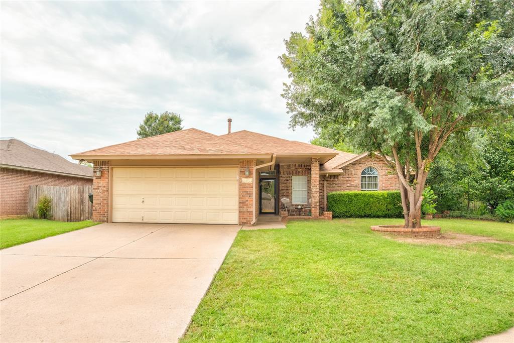 Close to all of the newly built Classen Boulevard hustle and bustle but nestled into a neighborhood, just down the road. This three-bedroom, two-bathroom home is ready for a new owner to make it theirs. Upon entrance, the flooring is tile throughout the common spaces and carpeted in the bedrooms. The concept is open for dining, kitchen and living rooms. The living area displays a red brick gas logs fireplace on the southern wall. Flowing effortlessly into the dining room, which features a built-in window seat, which doubles are storage as well. Lastly into the kitchen, boasting it's tile backsplash and there are granite countertops seen throughout the home.  There is a new sink/faucet with a garbage disposal @ the island overlooking the living room, as well as a dishwasher and electric glass top stove.  There is a separate laundry area in the mudroom between the kitchen and the attached, two car garage.The bedrooms are down the hallway from the living areas. The owner's suite on the left, showcases a tray ceiling with a ceiling fan, as well as big windows. The en-suite bathroom has a double sink, separated garden tub and shower, along with two closets. The guest bathroom is at the end of the hallway has a tile shower, and it is across the hallway, from the other two bedrooms. The back patio is oversized, and covered with brick pillars, overlooking the spacious backyard, and there are no neighbors behind you.