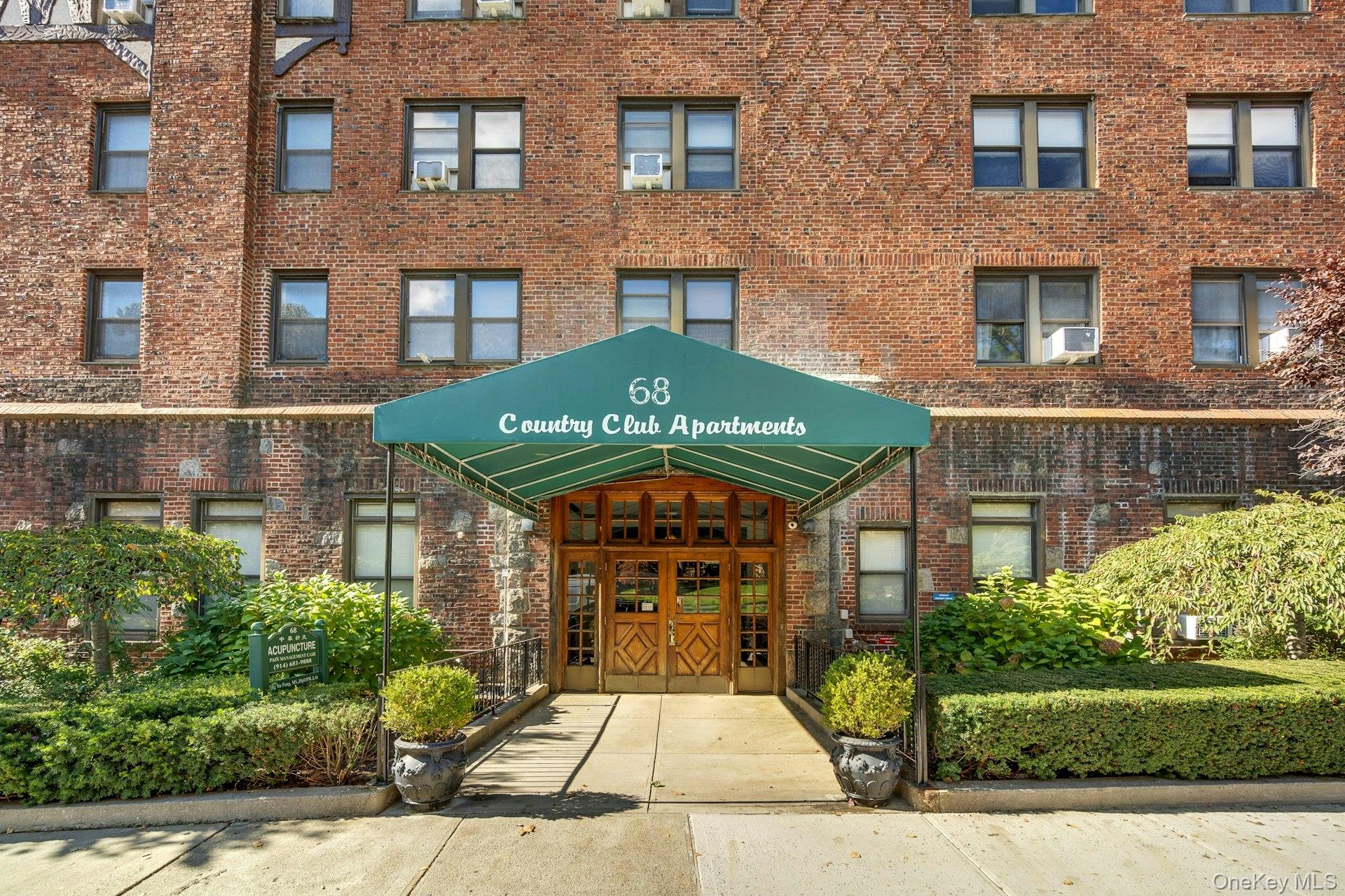 Welcome home to Country Club Apartments, a charming, pet-friendly Tudor-style residence perfectly situated just a 10-minute walk from the Hartsdale Metro North train station. This beautifully maintained unit features an updated kitchen with stainless steel appliances and abundant cabinetry, offering both style and functionality. Enjoy the warmth of hardwood floors, a cozy working fireplace, and fresh paint throughout, creating an inviting and move-in-ready space. The living room and dining area provide the perfect setting for entertaining or unwinding, while the spacious bedroom includes a walk-in closet with  shelving for optimal organization. Residents will love the building’s exceptional amenities, including a garage, fitness center, and meticulously landscaped courtyard designed for leisure and convenience. Nestled in the heart of Hartsdale, just steps from transportation, shops, and dining, Country Club Apartments combines the tranquility of suburban living with easy access to New York City—making it the perfect place to call home. This gem won’t last long!