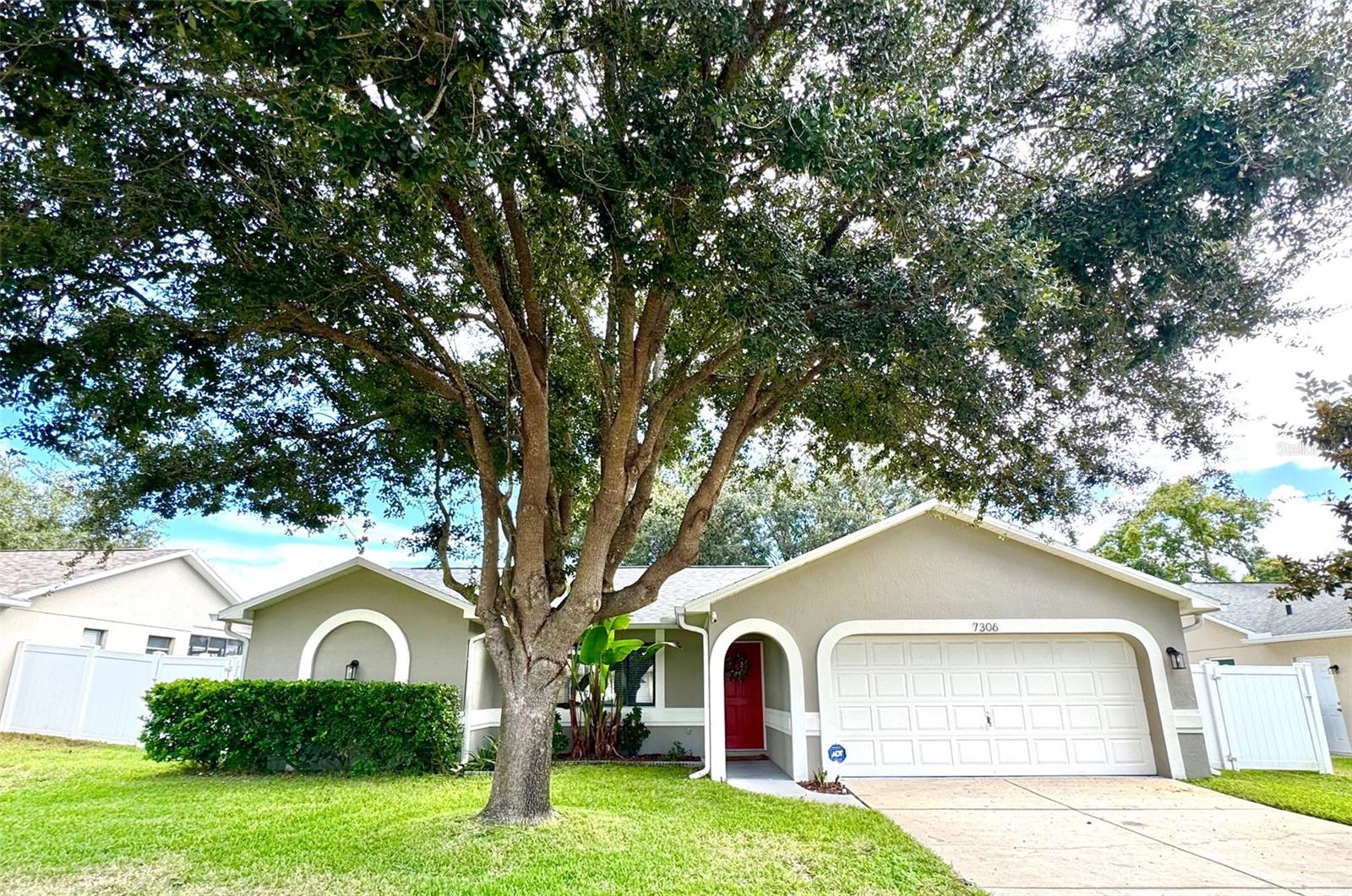 Pond front Paradise in Woodridge Estates! Welcome to this impeccably maintained 3-bedroom, 2-bath pond front home in the highly desirable, deed-restricted community of Woodridge Estates. From the moment you arrive, you'll appreciate the pride of ownership and thoughtful updates throughout.  Enjoy panoramic water views from your screened lanai, spacious brick paver patio, or the fully vinyl-fenced backyard—perfect for relaxing, entertaining, or casting a line in the well-stocked pond filled with largemouth bass! Bonus: the flat-screen TV on the lanai conveys with the home for your outdoor enjoyment. Inside, the home boasts a split-bedroom floor plan, vaulted ceilings that enhance the open feel and a beautifully updated interior. Recent upgrades include stylish updated bathrooms, newer hand-scraped engineered wood flooring, stainless steel appliances, stainless steel farmhouse style kitchen sink, fresh exterior paint, and a NEW ROOF installed in 2025. The kitchen features a breakfast bar that opens to the dining area—great for casual meals or entertaining. Additional features include: Water softener system, Washer and dryer included, Generator transfer switch already installed and a 1-year home warranty included at closing for your ultimate peace of mind.

All this, plus you're just a short drive to Sims Park and the charming shops, dining, and entertainment of downtown New Port Richey. Best of all—this home is NOT in a flood zone. Homes like this don’t come along often. Schedule your private showing today and start living the Florida lifestyle you’ve been dreaming of!