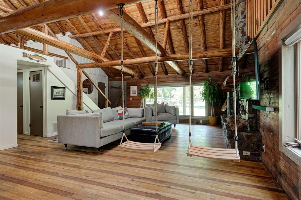 Experience this phenomenal four bedroom log cabin set on 3.33 scenic acres in Edmond, offering the perfect blend of peaceful country living and proven income potential. Spanning 2,320 square feet, this authentic cabin has been a highly successful Airbnb for the past four years, averaging approximately $5,500 per month in rental income with peak months reaching as high as $6,929.Inside, the home welcomes you with an open living area highlighted by soaring cathedral ceilings, exposed wood beams, and expansive windows that flood the space with natural light. A striking stone fireplace anchors the room, creating a warm and inviting atmosphere, while the kitchen delivers modern conveniences wrapped in rustic charm. All four bedrooms are thoughtfully designed to provide comfort, character, and privacy for guests or full time living.Step outside to enjoy the large covered porch, ideal for morning coffee or evening sunsets, overlooking abundant wildlife and serene surroundings. The stocked pond sits at the heart of the property, offering a relaxing backdrop for fishing or quiet reflection.Whether you are looking for a primary residence with income upside, a short term rental investment, or a weekend retreat that pays for itself, this property delivers. All furniture and everything you see in the house stays!  Rarely does a home combine this level of natural beauty, privacy, and established cash flow. Opportunities like this do not come along often. DO NOT APPROACH THE HOME OR DISTURB TENANTS. THIS IS AN ACTIVE AIRBNB. LISTOR SHOW ONLY, THANK YOU!