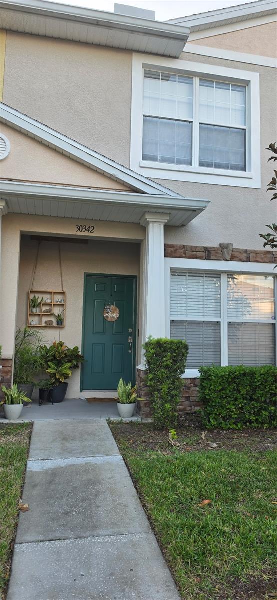 Welcome to this charming two-story townhouse in the gated Meadow Pointe III community of Wesley Chapel! Featuring 2 bedrooms and 2.5 bathrooms, this home offers a functional layout with comfortable living spaces. The open-concept main level includes a spacious great room and an eat-in kitchen, while the upstairs features two bedrooms with private bathrooms and an open loft ideal for a home office, reading area, or additional flex space. Enjoy relaxing on the covered, screened patio. Community amenities include a pool, fitness center, playground, and tennis courts. Conveniently located near shopping, dining, and everyday essentials, this home offers a wonderful opportunity to enjoy a comfortable lifestyle in a desirable community. Schedule your showing today and don't miss the opportunity of making this home yours!