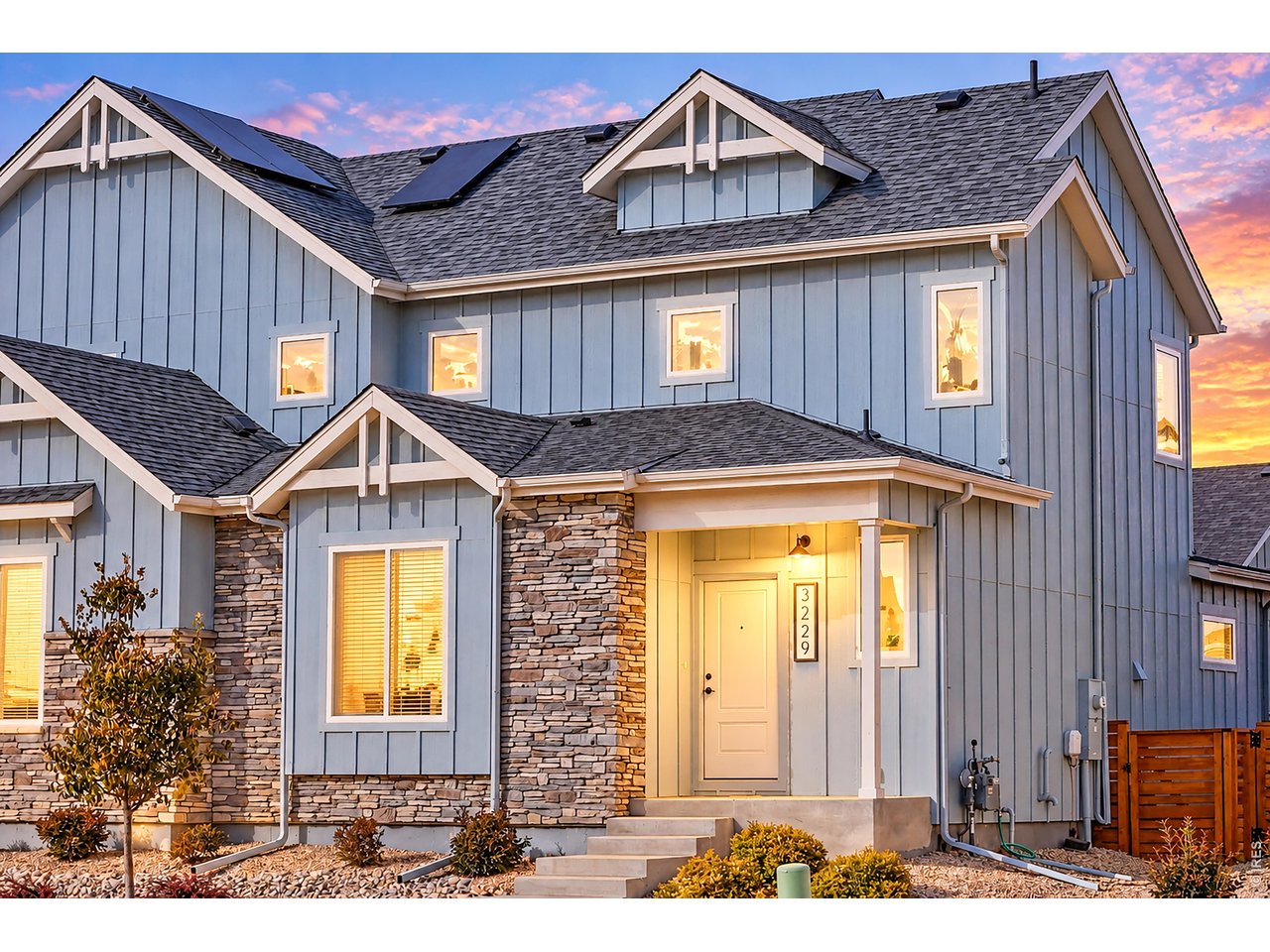 Beautifully designed paired home by award-winning Aspen Homes offers the perfect blend of comfort, functionality, and easy living. Enjoy a fenced backyard ready to make your own, an attached alley-load 1-car garage, and a low-maintenance lifestyle with front landscaping taken care of by the HOA. All this with low HOA dues and NO Metro Tax! Inside, the thoughtfully designed floor plan features a main-floor primary suite with a private ensuite bath and walk-in closet, plus the convenience of main-floor laundry. Luxury vinyl plank flooring flows throughout the main living areas, complemented by beautiful tilework in the bathrooms. The kitchen shines with quartz countertops and a vented gas range, while the living room is ready for movie nights, gaming, and relaxing at home. Upstairs, a bright, sun-filled loft offers incredible flexibility as a second living area, home office, playroom, or creative retreat. Two additional bedrooms and a full bathroom provide plenty of room for guests, family, or hobbies. Step outside to the fenced backyard, a blank canvas ready for your personal touch, whether you envision a cozy outdoor retreat, garden space, or entertaining area. The alley-load garage adds to the home's curb appeal, keeping the front exterior open, bright, and welcoming. Nestled near the foothills, this home offers easy access to the neighborhood park and Ponderosa Elementary School, and Fort Collins making it easy to enjoy the best of Colorado living. Energy-efficient features include a 95% efficient furnace, Energy Star windows, HERS energy rating, tankless water heater, and SEER 13 air conditioner. A Class 4 roof and active radon mitigation system provide additional peace of mind. Enjoy the freedom of low-maintenance living, a flexible floor plan, energy-conscious features, and a fantastic West Loveland location-all without a Metro Tax!