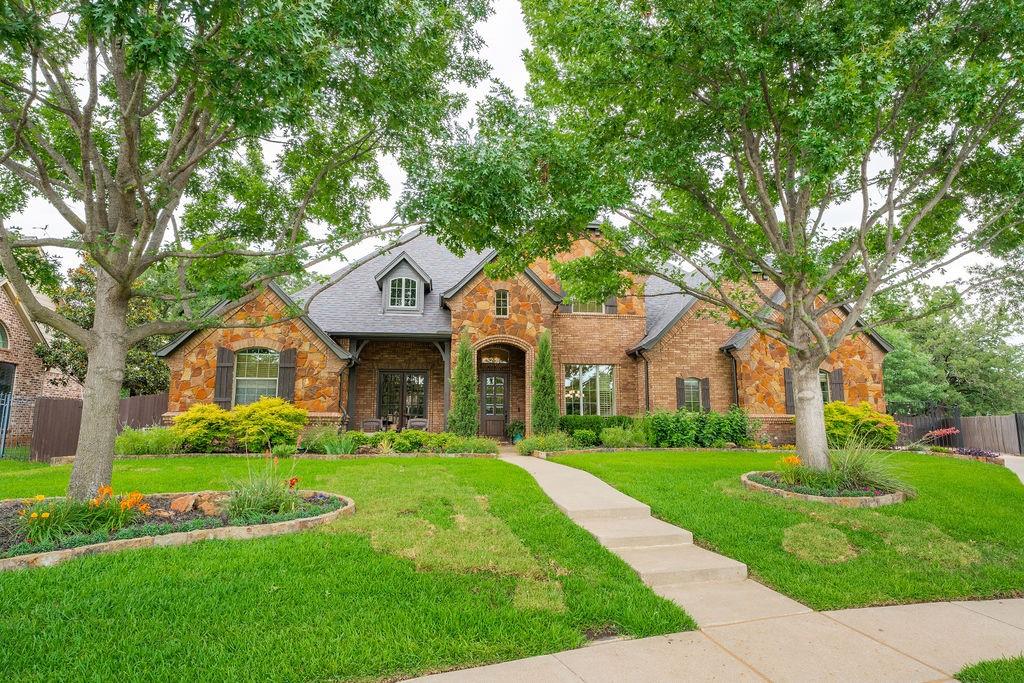 Tucked away on a quiet cul-de-sac in the heart of award-winning Keller ISD, this exquisite residence is the perfect blend of refined elegance and everyday comfort. Situated on a beautifully landscaped lot, the property boasts a true park-like backyard with lush greenery, mature trees, and a sparkling saltwater pool with a cascading waterfall creating a private oasis, perfect for relaxing or entertaining. Step inside to soaring ceilings, rich wood beams, and stunning hardwood floors that flow throughout the open-concept living spaces. Flooded with natural light, this home radiates warmth and sophistication at every turn. The chef’s dream kitchen is the heart of the home—offering a large island, double ovens, ample cabinetry, and plenty of prep space, all overlooking the expansive family room and dining area. A gorgeous private study with custom built-ins provides a peaceful workspace, while the oversized game room is ideal for movie nights, play, or casual gatherings. The magazine worthy primary suite is a true sanctuary featuring a spacious layout, serene views, and a spa-inspired ensuite bath with a walk-in shower, dual vanities, and an expansive walk-in closet. It’s the perfect place to unwind in luxury. Each secondary bedroom is generously sized, offering comfort and flexibility for family and guests alike. The home’s thoughtful layout provides space for both quiet moments and lively entertaining. The outdoor living is equally impressive, with covered patio, plenty of open yard space, and room to entertain year round. Whether you're lounging poolside, hosting weekend barbecues, or simply enjoying the peace of your surroundings, this home delivers unmatched lifestyle potential. Located just minutes from Keller Town Square, Bear Creek Park, Shady Grove Elementary, and an abundance of biking and walking trails. Also enjoy quick access to Historic Roanoke, Hawaii Falls, and Texas Motor Speedway this is Texas living at its finest.