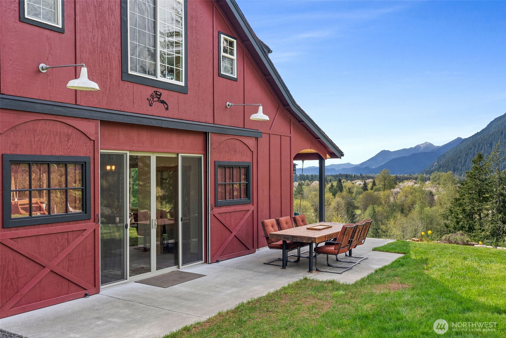 Unique home with fantastic view on almost 6 Acres. Direct access to Gifford Pinchot National Forest. Stunning panoramic Mountain & Valley views, perched on 100-ft bluff. Overlooks Big Bottom Valley. Custom features include live edge accents, 11’ ceilings, wide open living spaces, large kitchen with cement countertops and stainless appliances. Cedar lined covered porches. Main floor primary suite, heated bath floor, walk-in shower & closet. Upstairs boasts vaulted bonus room with unobstructed view picture window, 2 additional bedrooms & 1/2 bath.  Extras include 200+ sqft cabin, detached 20x30 heated garage/shop, RV/EV generator hook ups, Starlink. Fully furnished & outfitted. Just 7m to Packwood, 27 mi to Ski Area. Why would you ever leave!