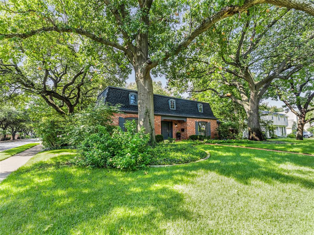 Set beneath a canopy of towering Live Oaks, this fully renovated West Highland Park home combines classic appeal with modern design throughout. Situated on a desirable 80’ corner lot, the residence spans over 2,600 square feet and features three spacious bedrooms and three and a half bathrooms.

The welcoming entry opens to bright interiors that flow effortlessly from room to room. The kitchen is fully renovated with stainless steel appliances, including a Bosch oven, gas cooktop, and dishwasher, along with painted cabinetry and sleek countertops. A breakfast area and adjoining den create a natural setting for daily living, while the large living room with a gas log fireplace connects seamlessly to the dining room for entertaining. 
The primary suite is generously sized and includes two closets. Its renovated bathroom showcases marble tile, a free-standing tub, dual vanity, and a separate shower. The secondary bedrooms are equally inviting. One features a striking wall of custom built-ins, perfect for storage or display, while the third bedroom is generously proportioned with abundant natural light. Each bedroom includes its own en-suite bathroom, ensuring comfort and privacy for family and guests alike.

The backyard extends the home’s living space with wood decking, pergola, two fountains, and a side patio featuring a Koi pond - providing spaces for both relaxation and privacy.

A detached garage offers a covered walkway to and from the home. Attached to the garage is a separate quarters with its own full bath, under-counter refrigerator, and sink. This versatile space can serve as a guest suite, home office, or gym.

Blending thoughtful updates, quality finishes, and an exceptional lot, 4601 Lorraine Avenue is a rare opportunity in West Highland Park.