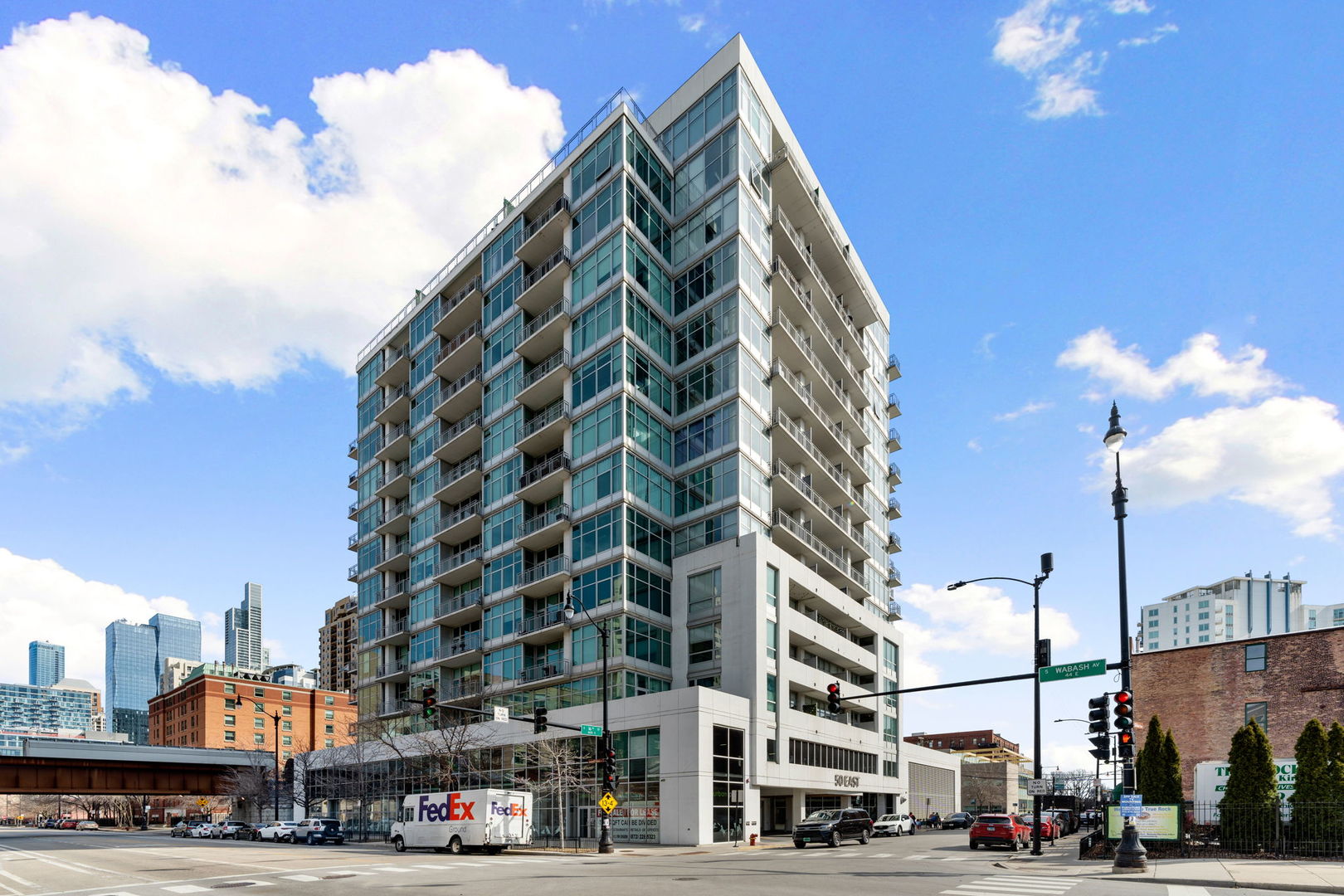 Experience luxury living at its finest in this exquisite 3 bedroom, 2 bath penthouse, offering sweeping panoramic views of the lake and skyline. Perfectly designed for both relaxation and entertaining, this home boasts a sprawling 15 x 45 foot private rooftop terrace -- an ideal outdoor space for gatherings, dining, or simply enjoying the breathtaking views of the city. The open floor plan seamlessly connects the expansive living room, separate dining area, and gourmet kitchen. The kitchen features sleek quartz countertops with waterfall edge, stainless steel appliances, and a range hood, plus a convenient eat-in counter with additional seating making it the heart of the home. Bedroom off the living area offers versatility with a murphy bed, perfect for guests, or an office space. The spacious primary bedroom features a generously sized en-suite bathroom with double vanity, separate tub and shower, and abundant storage. A third bedroom is located off the main hallway in addition to the secondary full bathroom. For added convenience, a full size stackable washer/dryer is included in the unit, along with a separate storage unit. This full-amenity building offers everything you need, including an exercise room, door staff, and elevator service. The location couldn't be more ideal-close to dog parks, shopping, restaurants, Grant Park, Museum Park, museums, the lake, and public transit. A 2-car tandem parking space is available for an additional $45K.
