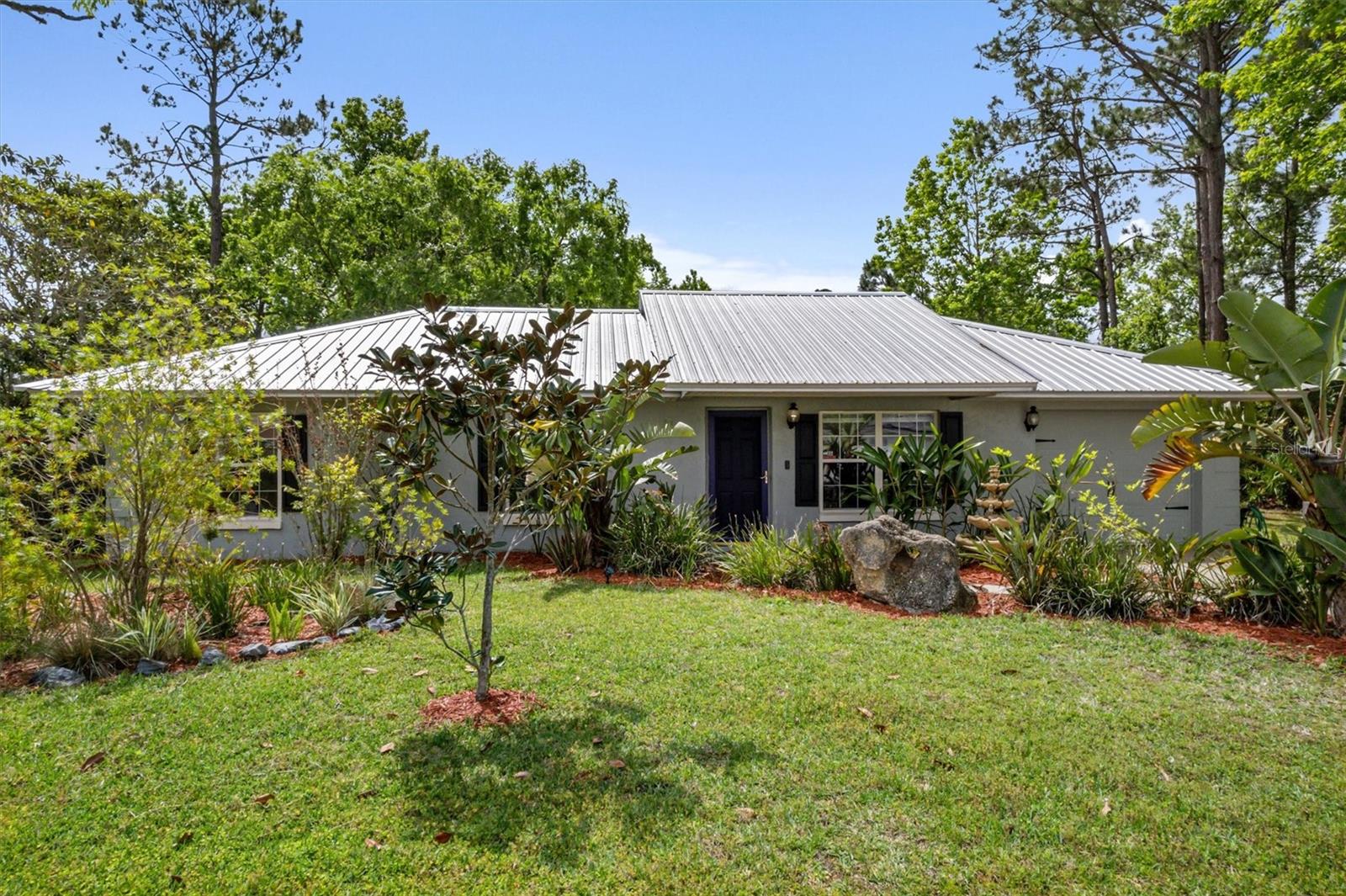 Welcome to this beautifully maintained 3-bedroom, 2-bath pool home, set on a rare DOUBLE LOT —over half an acre of space and endless potential! Expand the home, add a guest house, or enjoy extra privacy—this oversized lot offers flexibility you won’t find elsewhere. Enjoy a custom saltwater pool (2019), new metal roof (2019), updated A/C (2021), and a storage shed (2018). Inside features include fresh paint, new window coverings, and a bright, open layout perfect for relaxing or entertaining. Lush landscaping and a custom mailbox add curb appeal, but it’s the double lot that truly sets this home apart. Located just 1 mile from the brand-new $13M Dog Park, Pickleball & Rec Center, and near top-rated schools, shopping, and parks—plus just 15 minutes to Flagler Beach. This is more than a home—it’s a rare chance to own space, style, and future opportunity in a prime location!