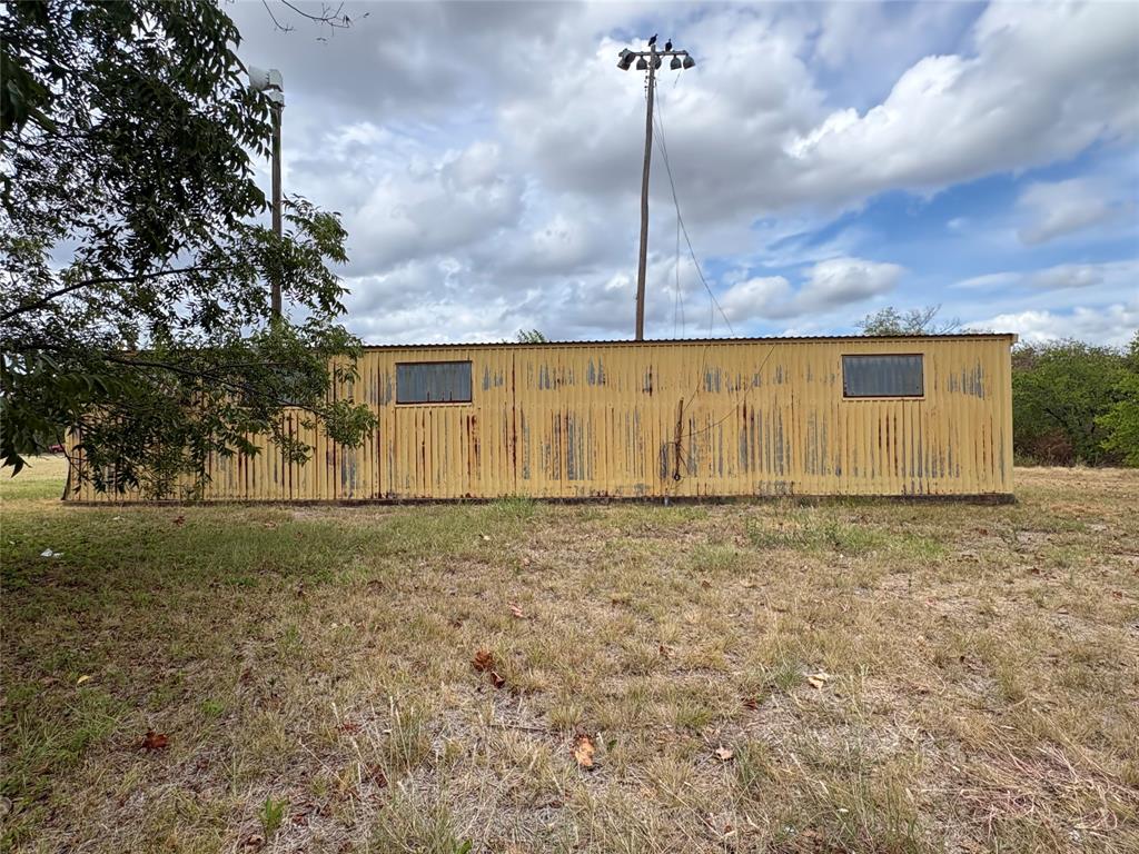 Here is a nice lot located close to downtown and school. Located in a residential area with opportunities for home, duplex, apartment or investment property. Buyer to verify all zoning or any building restrictions with the city. There is currently a metal building with concrete floor on the property. New survey available.