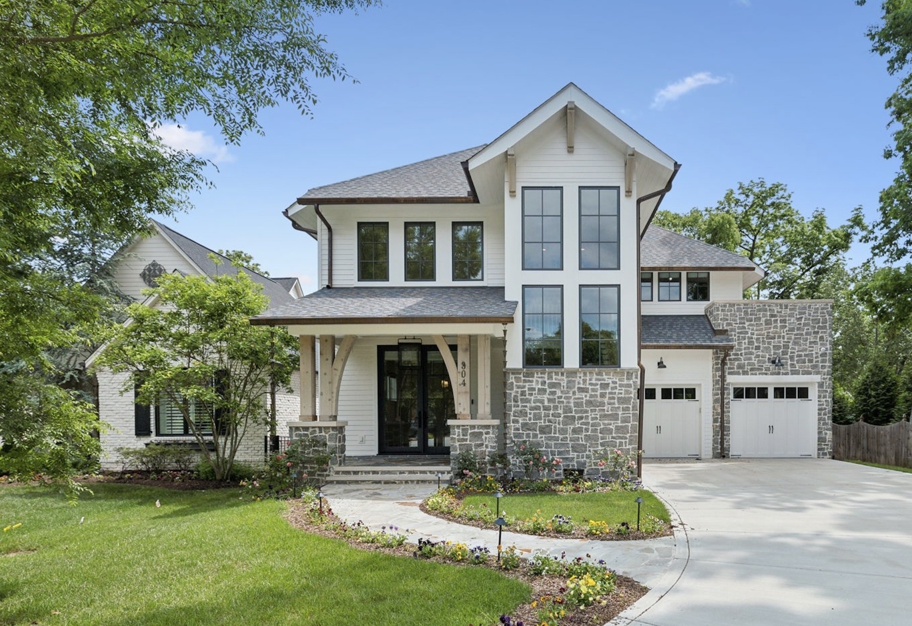Refined southern living in the heart of Franklin. Tucked right off of one of Franklin’s most desirable streets, 304 Berry Circle is a masterclass in modern craftsmanship and timeless elegance. This custom-built residence showcases a harmonious blend of clean architectural lines and rustic stone accents, copper gutters, all framed by lush landscaping and a winding drive that makes an unforgettable first impression. Inside, the home exudes sophistication with soaring ceilings, wide-plank hardwoods, and designer lighting throughout. The gourmet kitchen is a chef’s dream. Anchored by a grand island, wrapped in custom cabinetry, and outfitted with professional-grade appliances. Oversized windows flood each space with natural light, and some contain automated window treatments, while carefully curated finishes add warmth and character to every room. Retreat to the serene screened porch with an outdoor grill, space heaters, and a floor-to-ceiling stone fireplace—a showstopping space where indoor comfort meets outdoor tranquility. The luxurious first-floor primary suite features a spa-worthy bath with a soaking tub, smart toilet and glass shower, and private office or flex space. All bedrooms have walk-in closets and ensuites. The bonus room upstairs has vaulted ceilings and french doors that open to an additional outdoor living space. Home is equipped with a full AV system. With its tailored elegance, generous layout, and seamless connection to nature, this residence offers the perfect balance of luxury and livability—an exquisite place to call home in the heart of historic Franklin.