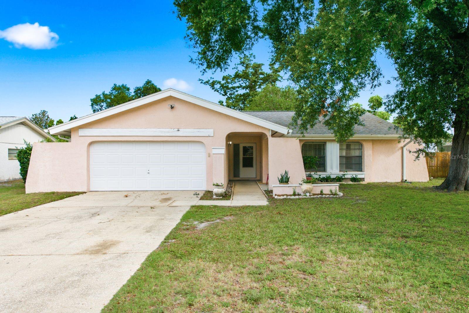 Welcome to your own slice of Florida living! This beautifully updated 3-bedroom, 2-bath pool home with a 2-car garage is located in the highly desirable Lake St. George community. Inside, you'll find a bright, open living and dining area with two sets of sliding glass doors that fill the home with natural light and seamlessly connect to the covered lanai, screened pool, and oversized backyard - perfect for entertaining or relaxing year-round. The newly renovated kitchen (2025) features modern finishes, updated cabinetry, and a functional layout. Major updates include a new HVAC system (2025) and a newer roof (2020), providing peace of mind for years to come. Outside, enjoy your private backyard retreat with a spacious screened pool, covered lanai, and plenty of room for family gatherings and outdoor fun. Conveniently located just minutes from shopping, dining, parks, Gulf beaches, and Tampa International Airport, this move-in-ready home offers the perfect blend of comfort, convenience, and the Florida lifestyle. Whether you're looking for a primary residence, seasonal retreat, or investment opportunity, this home is one you won't want to miss!