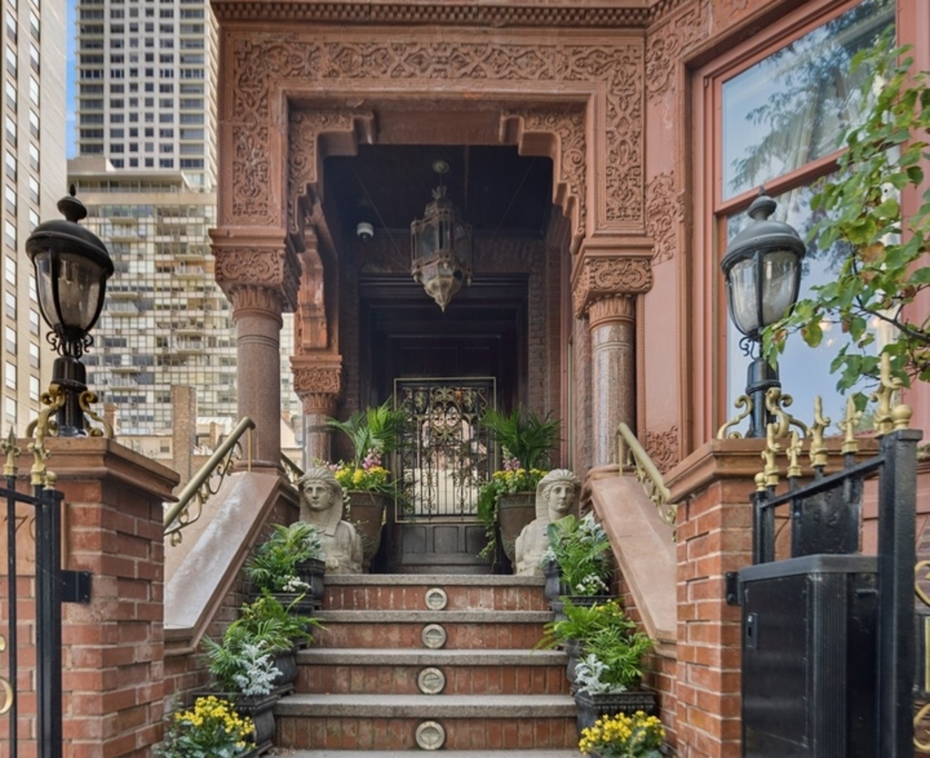 Welcome to 79 East Cedar Street. This is a rare opportunity to acquire a home of significant scale and presence in the Gold Coast-one of Chicago's most vibrant and historic neighborhoods. In 1884 Bertha Palmer commissioned architect Joseph Lyman Silsbee of Silsbee and Kent to create a neo-Moorish masterpiece design to transcend the ordinary. This meticulously refurbished home weds traditional grandeur with modern innovations. With approximately 7,523 square feet, this house charms with its private, incomparable roof terrace holding court over lake and sky, showing dazzling vistas. A stately solarium crowns the house, giving panoramic views day and night across Chicago's skyline-a truly special all year retreat in the heart of the city.  A Parisian-style elevator serves all floors. Living space includes four bedroom suites, five bathrooms, three kitchenettes, a theater room is perfect for cozy nights in, while a wine room, utility room and a two-car garage, complete the plan.  Set on one of Chicago's most prestigious addresses, approaching the property, one is met with elegant stone steps, flower boxes, and statuary.  Original latticework and wrought iron fences captivate the eye. Heated pavement in front of the home, as well as outside the garage, keeps the residence easily accessible year-round. This splendid, curated retreat offers privacy and style with comfort and function: a seamless blend of present, and future.