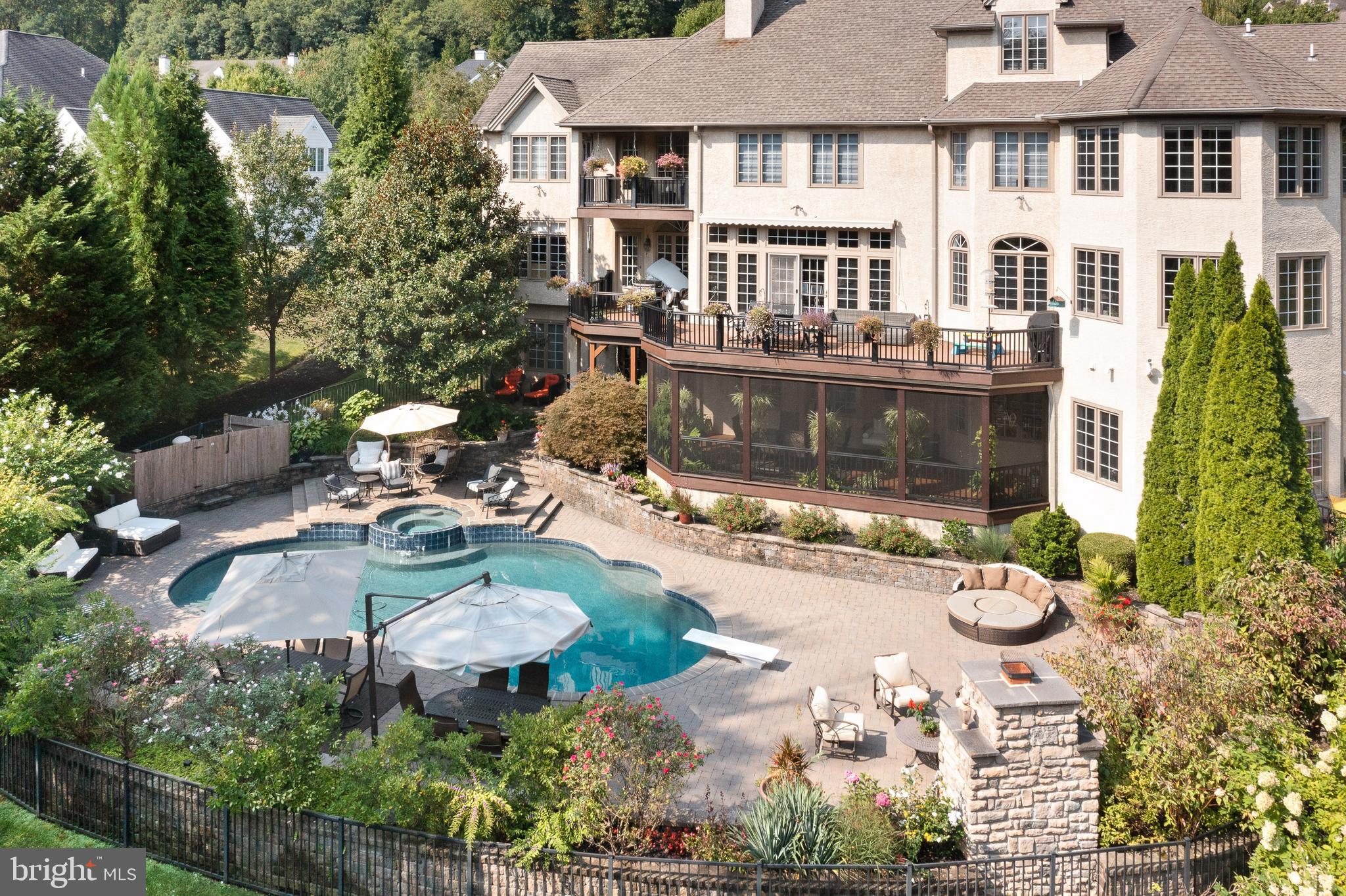OPEN HOUSE SUNDAY 4/12, 1-3pm. WOW! Come see the updates. Recently refinished hardwood floor, fresh paint & new fixtures. This estate home features a 5 CAR ATTACHED GARAGE with lifts, housing 8-9 cars! Welcome to 365 Arbor Circle, a masterpiece of luxury and timeless elegance nestled in popular Media. Custom built by master builder Jack Quinlen, this stately 6-bedroom, 9-bathroom estate home with an elevator and a 5 car attached garage redefines upscale living, offering a harmonious blend of impeccable design, amenities, & seamless blend of comfort and sophistication. As you enter, you're greeted by a grand 2-story foyer that sets the tone for the exquisite craftsmanship and attention to detail found throughout the home. The foyer is flanked by the formal dining room on the left and the living room with gas fireplace & tray ceiling on the right. Continue to the home office with cherry built-ins, amazing views and a wet bar connecting the office & living room with a formal half bath. The gourmet kitchen has been expanded & remodeled with high-end appliances, built-in refrigerator, dishwasher drawers (Bosch), beverage drawers, double ovens, gas cooktop, a warming drawer (all Wolf) and a large island. A butler’s pantry with wine fridge connects the kitchen and the dining room for seamless entertaining. The sunny breakfast room is adjacent to the kitchen with built-in cabinetry and a convenient desk. Off the kitchen is a huge Trex deck with retractable awning, ideal for alfresco dining. The cozy family room features a gas fireplace, built-ins and coffered ceiling, perfect for watching a movie on a chilly evening. A separate laundry room with a second refrigerator, casual powder room and 5 car attached garage complete this floor. The sellers installed Geothermal heating, which dramatically reduces utility costs. The second level includes 5 en-suite bedrooms. The primary suite is a sanctuary with a gas fireplace, tray ceiling, private balcony, sitting room, huge walk-in closet (with island) and a gorgeous bathroom with dual vanities, jetted tub, extra large shower and heated towel bar. Imaging relaxing in the jacuzzi tub with views of Ridley Creek! Also on this level is a private gym with back stairs to the mudroom area. There are 4 more spacious bedrooms, all with walk-in closets (with closet systems) and private bathrooms. The third level is well suited for overnight guests and features a separate suite with bedroom, full bathroom, and a living room. An elevator effortlessly connects the levels, adding a layer of seamless convenience, while the expansive 5-car attached garage (with lifts) provides ample space for car enthusiasts or multigenerational households. The heart of the home lies in its unparalleled entertaining spaces. The finished basement is nothing short of spectacular, designed to be the ultimate gathering place. Picture yourself hosting unforgettable Eagles parties at the full bar, whipping up culinary delights in the second kitchen, or enjoying movie nights in the state-of-the-art home theater. And when it’s time to relax, step outside to your own private resort—a sparkling in-ground pool and spa with outdoor fireplace, surrounded by lush landscaping, ideal for sun-soaked afternoons or serene evening dips under the stars. There is a large screened in porch under the deck with a view of the gorgeous pool. Set on a pristine lot, 365 Arbor Circle offers an enviable combination of privacy & accessibility. Tucked away in a serene neighborhood backing up to open space and yet conveniently close to top-rated Rose Tree Media schools, fine dining, & boutique shopping, this location perfectly complements the home’s upscale lifestyle. Whether you're strolling through charming local streets, indulging in cuisine from nearby award-winning restaurants, or exploring the area’s cultural offerings and social events, you’re  just moments away from the vibrant town of Media. One can not build this home today at this price.