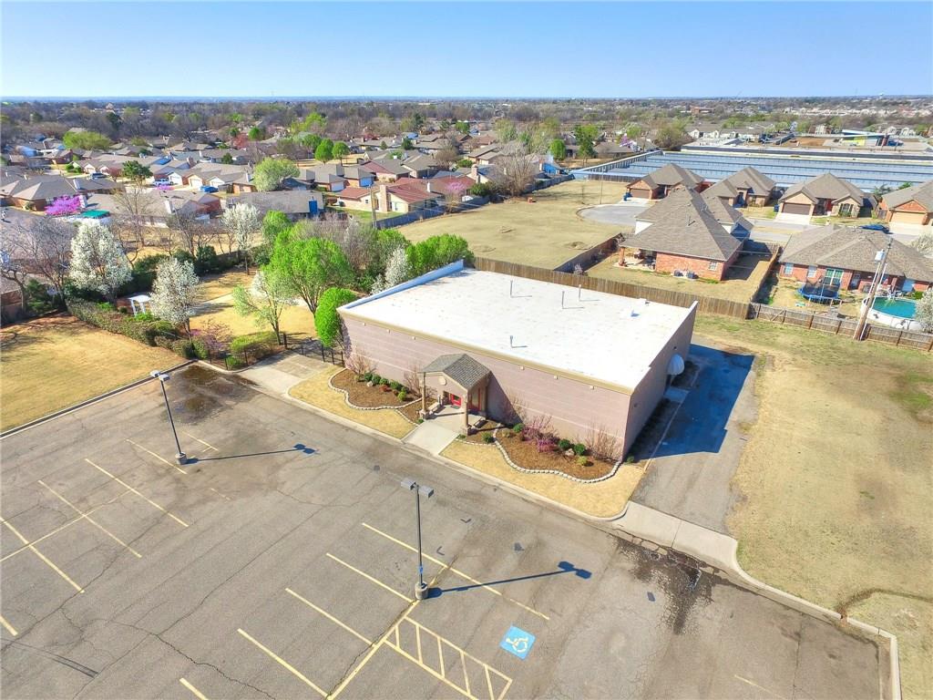 A PREMIER commercial opportunity: The Stonebrook Event Center! Perfectly situated just west of I-35 at SW 89th and Robinson, this prime location offers quick highway access. Originally built in 1999, the property has been remodeled from top to bottom by the current owner. The versatile, customized layout shines as a high-end wedding venue but effortlessly accommodates corporate functions, galas, and private parties. Inside, guests are greeted by a grand reception hall, dedicated staging areas, kitchen and prep space. The experience extends outdoors to a beautiful garden area. Complete with sound and lighting systems, this property is ready for immediate operation.