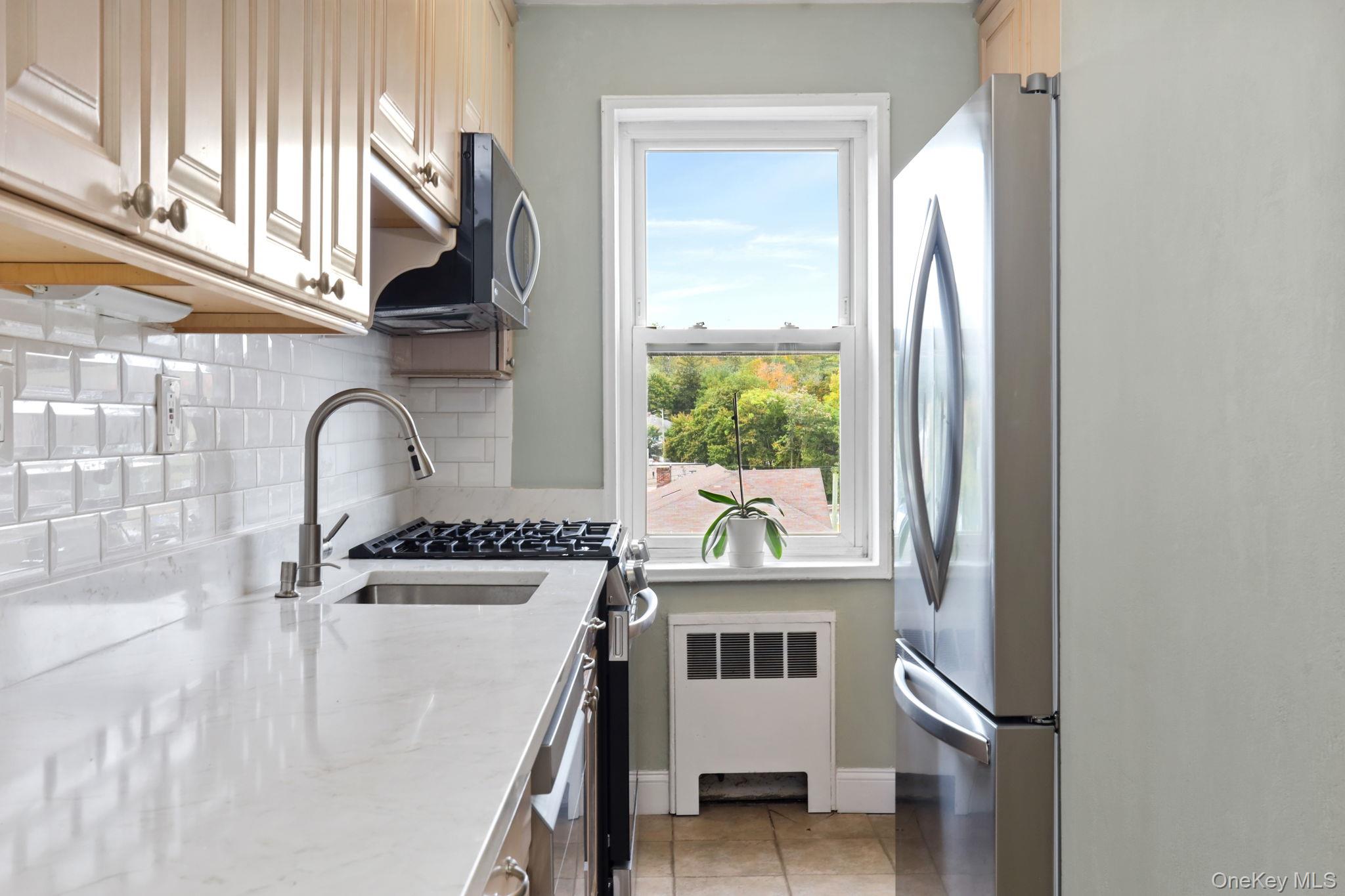 Commuter's Dream! A nicely updated Junior 4 apartment!  Fourth floor unit, a large co-op in a secure building.    Easy 0.4-mile to MetroNorth Hartsdale Station, ~35-min express to Grand Central or super close to Central Ave. for BeeLine express bus to NYC, Yonkers, or White Plains.  Close to all major highways, shopping and Hartsdale downtown.  Renovated top floor one-bedroom "Junior 4" unit.  Large renovated kitchen with all new stainless steel appliances, abundance of cabinets and counters.  Kitchen opens up to a formal dining area and a large open living room!  A large corner unit with flexibility for a den or office.  Updated bath.  Many closets throughout apartment.  Nice hardwood floor as seen.  Building requires 80% carpeting in unit.  Priced to sell.  Move-in Ready!