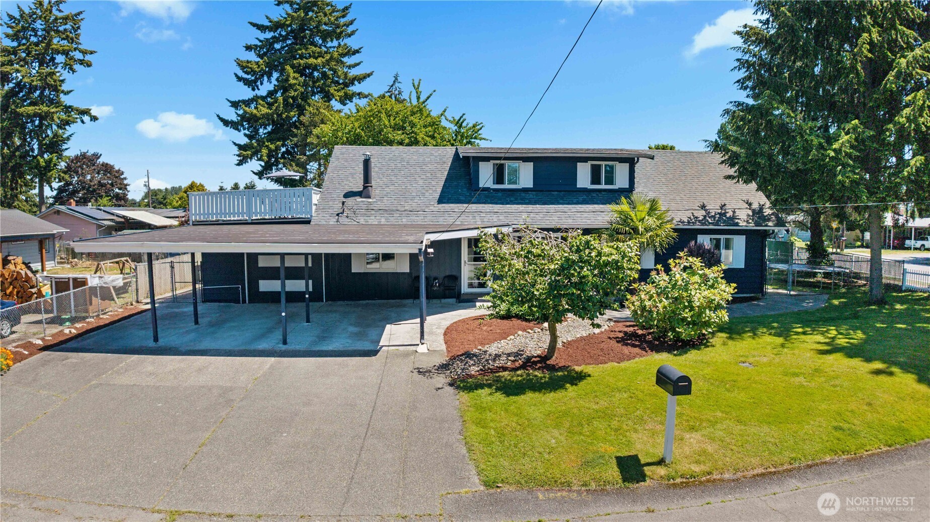 Spacious two-story home with four bedrooms and three full bathrooms, including a main-level primary bedroom, offering a flexible multigenerational layout. Two additional bedrooms and a full bathroom are located upstairs. Fully fenced backyard includes a deck, detached storage shed, and double gate from the street for RV or boat parking. Rooftop deck offers Puget Sound and mountain views. Oversized one-car garage plus three-car carport and driveway parking for additional vehicles. High speed fiber optic internet now available! Kitchen remodel and appliances completed in 2021. Furnace replaced in 2021; crawl space mediation and spray foam insulation completed in 2020. Convenient location with Kent/Des Moines and Star Lake light rail stations just 1.3 miles away, .7 miles to Highline College and only 3.5 miles to SeaTac Airport.