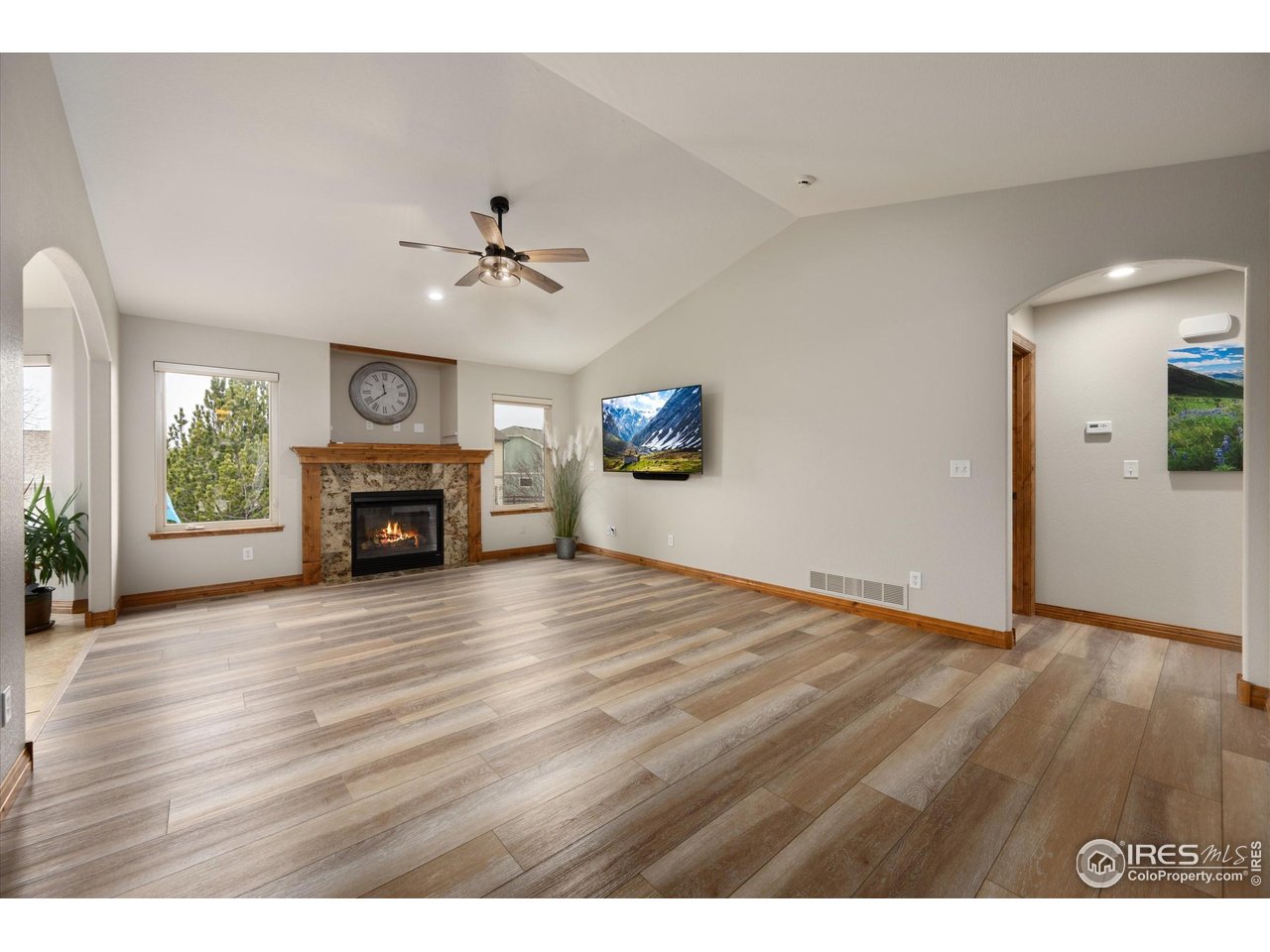 You will positively love this beautiful ranch-style home w/ full walkout basement & a setting that feels both peaceful and special. From the welcoming entry-with dry-stacked stone accents and professionally designed landscaping-it's clear this home has been carefully maintained with pride. Inside, the main floor is open, breezy, and filled with light, featuring high ceilings, luxury vinyl plank flooring in the living area, and even a solar tube that brightens the dining space. The kitchen is warm and inviting, with handsome knotty alder cabinetry and all appliances included. The main-floor primary suite feels grand and comfortable, with soaring ceilings, a five-piece luxury bath, and a walk-in closet. Out back, a wonderful deck overlooks a beautifully curated yard with mature trees and a terrific pond-an ideal place to relax or entertain. The fully finished walkout basement offers a generous family and entertainment space with a nicely appointed wet bar, plus a lower-level fourth bedroom that lives almost like a private guest suite. The basement even features secondary laundry hookups if needed! Three fireplaces throughout the home add warmth, character, and charm on both levels.