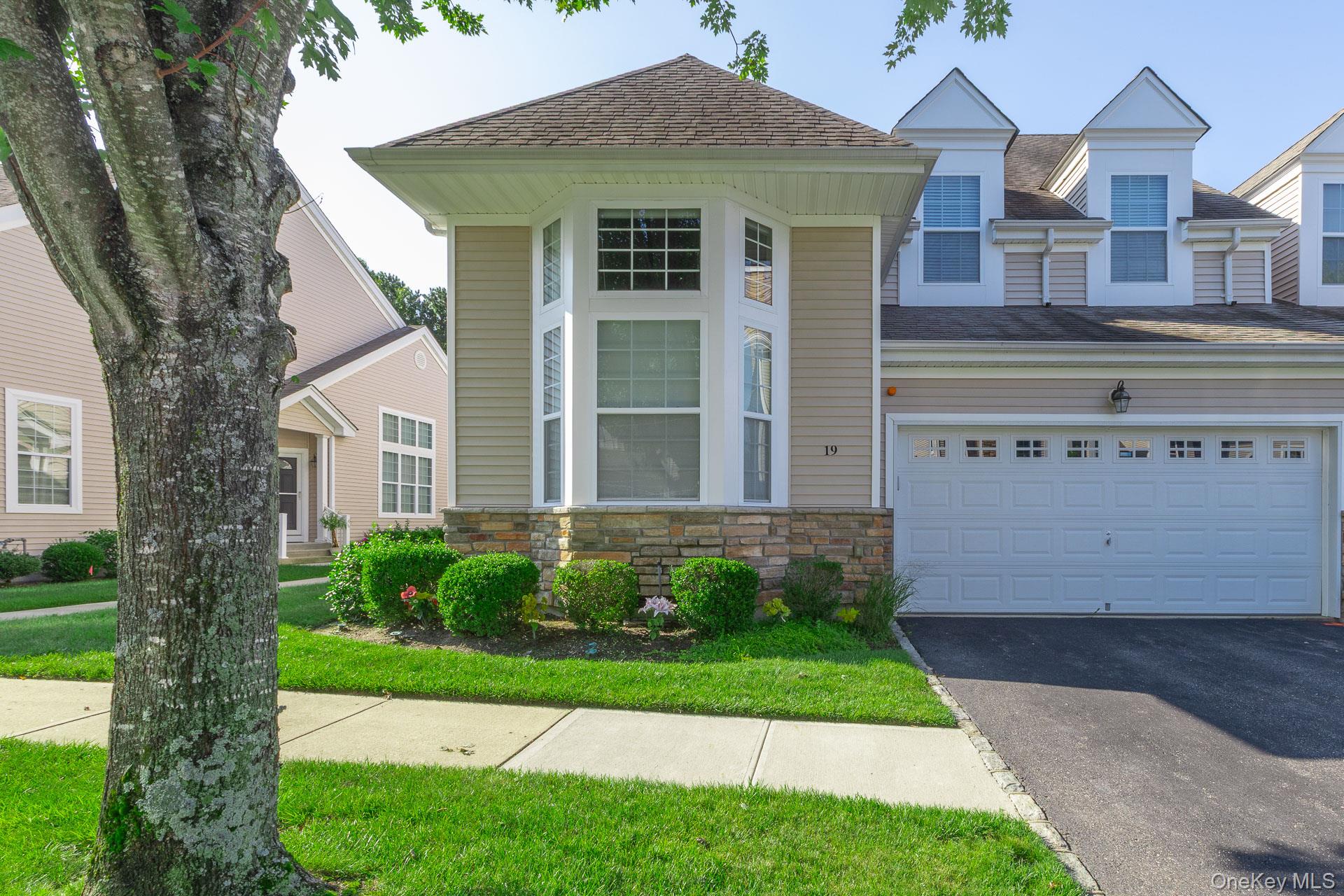 Welcome to 19 Emilie Dr., a beautifully maintained Chablis Model townhouse in the Vineyards at Moriches -an exceptional community offering outstanding value among local 55+ communities. Every home here is an end unit, providing added space, privacy, and a bright, open feel with lots of windows. The comparatively low HOA fee includes numerous benefits that you won’t typically find in similar communities, making this an ideal place to enjoy an effortless, worry-free lifestyle. This home is turnkey and ready for you to move right in, with a First-floor primary suite, large, open floor plan perfect for everyday living and entertaining, including the living room with gas fireplace, dining room, large kitchen and a family room. The second bedroom is upstairs, great for guests, a home office, or hobbies, with a full bath and a large bonus room. The impressive full basement is truly tremendous, featuring full-height ceilings, completely insulated walls and plenty of room for storage with potential for future expansion. Vineyards at Moriches is a gated community with a magnificent clubhouse, including: gym, recreation rooms, heated pool, Bocce court, Pickleball/tennis court. Conveniently located with easy access to major highways and a short drive to The Hamptons. Come and buy the perfect lifestyle!