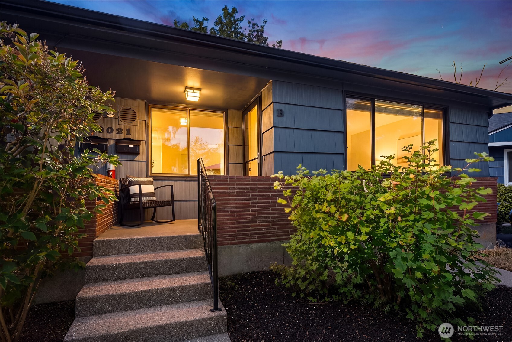 Beautiful mid-century, boutique condo in an intimate five-unit building, tucked away on a quiet dead-end street bordering the forest. This two-bedroom home features an extra-large bedroom, in-unit laundry, a stunning renovated bathroom and dedicated dining space. Enjoy a private outdoor entry, space for gardening or relaxing, and peaceful surroundings in a fantastic location. A nearby trail leads to Carkeek Park, its playground and the beach. Leave the car behind for easy access to nature, shopping and restaurants. Small HOA with low dues, minimal shared decisions, and potential special assessments. Pre-Inspected for peace of mind.