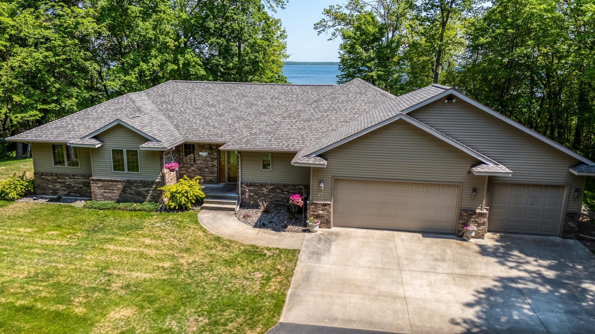 Here is your chance to enjoy the CASS LAKE CHAIN  with all it has to offer!  Owning property on Cass Lake provides more than ample recreation opportunities as it is a CHAIN OF 8 LAKES including the Mississippi River.  This is a 2004 built large rambler style home with a full basement (3,702 sq ft)  Amazing views!  4 bedrooms, 2.5 baths, four season sunroom, gas fireplace, vaulted T&G ceilings, huge workshop, lakeside deck, steel and brick siding, double staircases, immaculately maintained. There is also a a 26 x 30 pole building in addition to the heated triple attached garage.  This amazing property is 3.61 acres, and 392 feet of frontage on beautiful Cass Lake.  Home has had a brand new roof installed.  Make sure to view the 360 virtual tour and schedule a private showing.  Summer is calling!