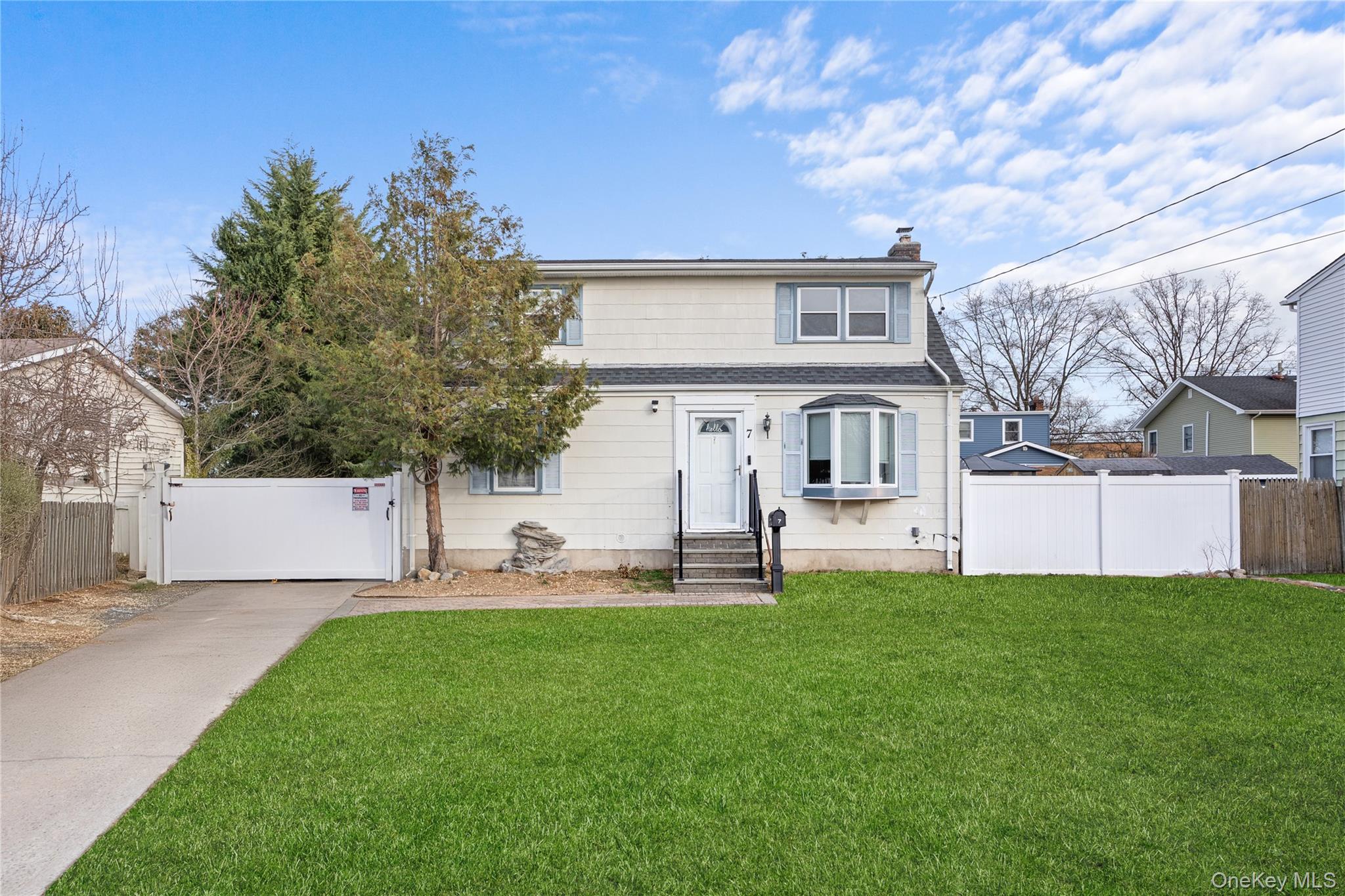 Welcome to 7 East Court, Bethpage a versatile home offering comfort, functionality, and room to grow. This property features 4 bedrooms and 2 full baths. The outdoor space is ideal for entertaining, with a large deck, above-ground pool, patio, and a generously sized backyard perfect for gatherings or relaxing at home.The full basement offers excellent additional space, complete with a bar area on one side and a separate laundry area on the other. The partially finished basement offers a great opportunity for buyers to customize and design the space to suit their needs.With the proper permits, the layout offers potential to be configured into two separate living spaces, adding flexibility and long-term value.