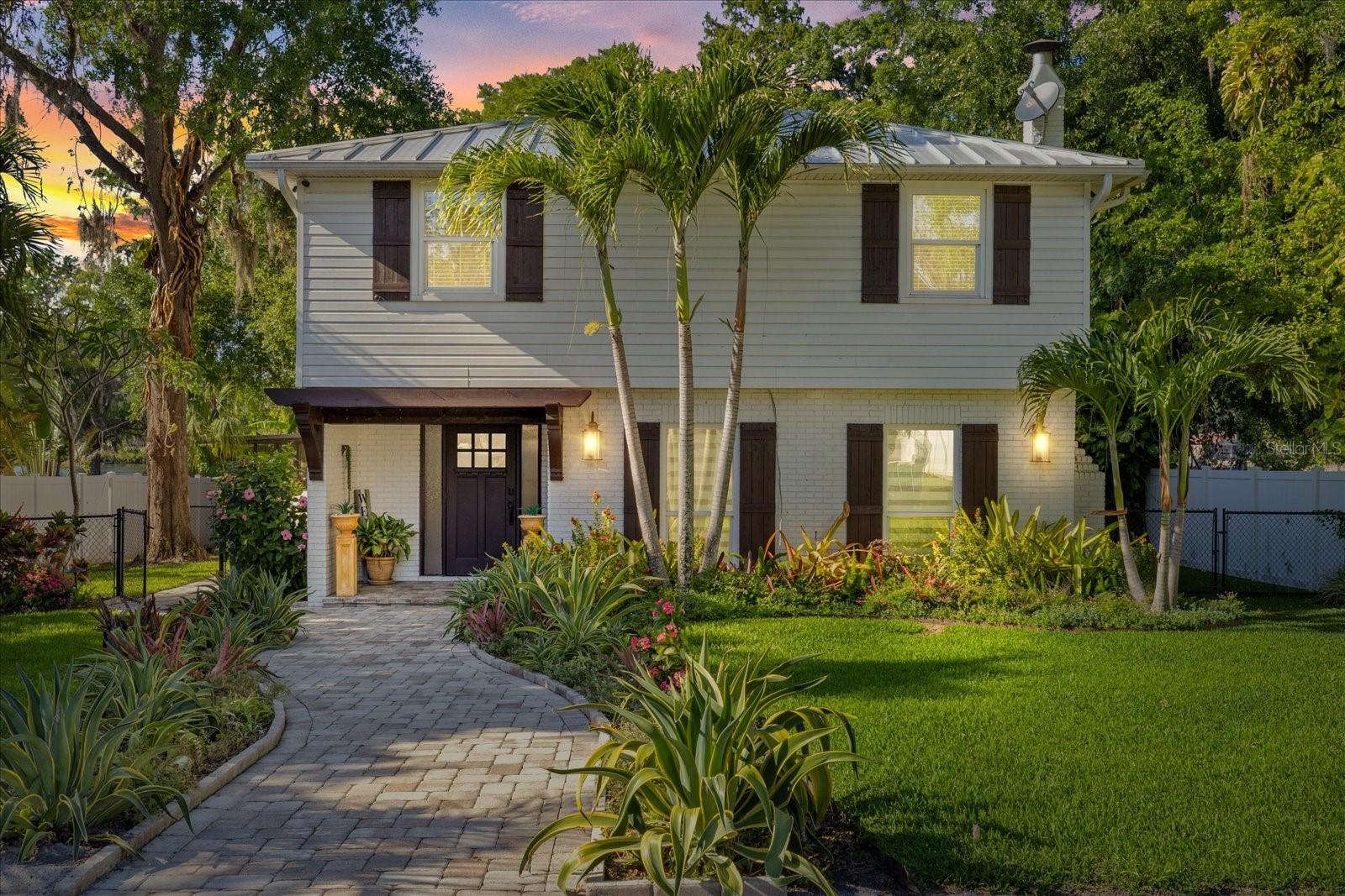 A HIDDEN OASIS IN HILLSBOROUGH RIVER. Tucked away on an expansive .74-acre lot along the widest stretch of the Hillsborough River, this beautifully updated 4-bedroom, 2.5-bathroom home blends indoor comfort with outdoor adventure like no other.  Step inside to discover a bright, airy interior freshly painted in warm, inviting tones. The home features new flooring throughout, adding a touch of modern elegance to every room. The kitchen has been refreshed with gleaming granite countertops and crisp cabinetry ready for everything from casual breakfasts to holiday spreads. The bathrooms have also been thoughtfully updated, boasting stylish vanities and contemporary tile work that bring a spa-like feel to your daily routine.  But the real magic begins outside.  Fire up the grill in your fully equipped outdoor kitchen, designed for epic cookouts, Sunday brunches, and sunset dinner parties with family and friends. The oversized backyard offers endless space to entertain, relax, or simply soak in the serene views of the river just beyond your lawn.  Calling all water lovers: this property is a boater’s dream. Drop a line and go fishing, hop on your skis, or cruise the river from your private dock, which includes a boat lift with electric and water hookups. It’s not just a backyard it’s a lifestyle.  Whether you're sipping your morning coffee while the fog lifts over the water, or toasting marshmallows under the stars, this home offers a rare chance to live your Florida dream to the fullest.  Come experience life on the river where home is both a sanctuary and a launchpad for your next adventure.
