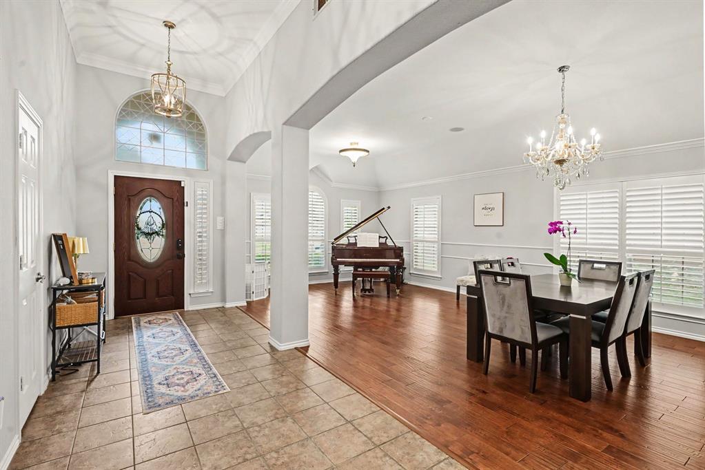 **Open House this Saturday May 16 from 11-2:30** Video walk-through available on YouTube by searching for address. Rare opportunity near Eagle Mountain Lake! This stunning home sits at the end of a private cul-de-sac, offering unparalleled privacy and curb appeal defined by massive oak trees and professional landscaping. The interior has been completely transformed with custom finishes throughout, including a designer kitchen, spa-like bathrooms, premium flooring, and high-end lighting and plumbing fixtures. Rest easy knowing the most expensive items have been well maintained throughout the years.The functional layout flows seamlessly to the backyard oasis, which features two separate covered patios, one with an integrated outdoor kitchen, perfect for entertaining in the shade. A standout feature of this property is the detached garage or workshop located in the back, fully equipped with electricity for the ultimate hobbyist space. This air-conditioned workshop is additional to the attached, standard, 2-car garage, both of which include plenty of extra storage space. Located just blocks from the local elementary school and scenic lakeside jogging trails, this home perfectly balances luxury, utility, and a prime location. Schedule your showing today to experience this one-of-a-kind retreat.