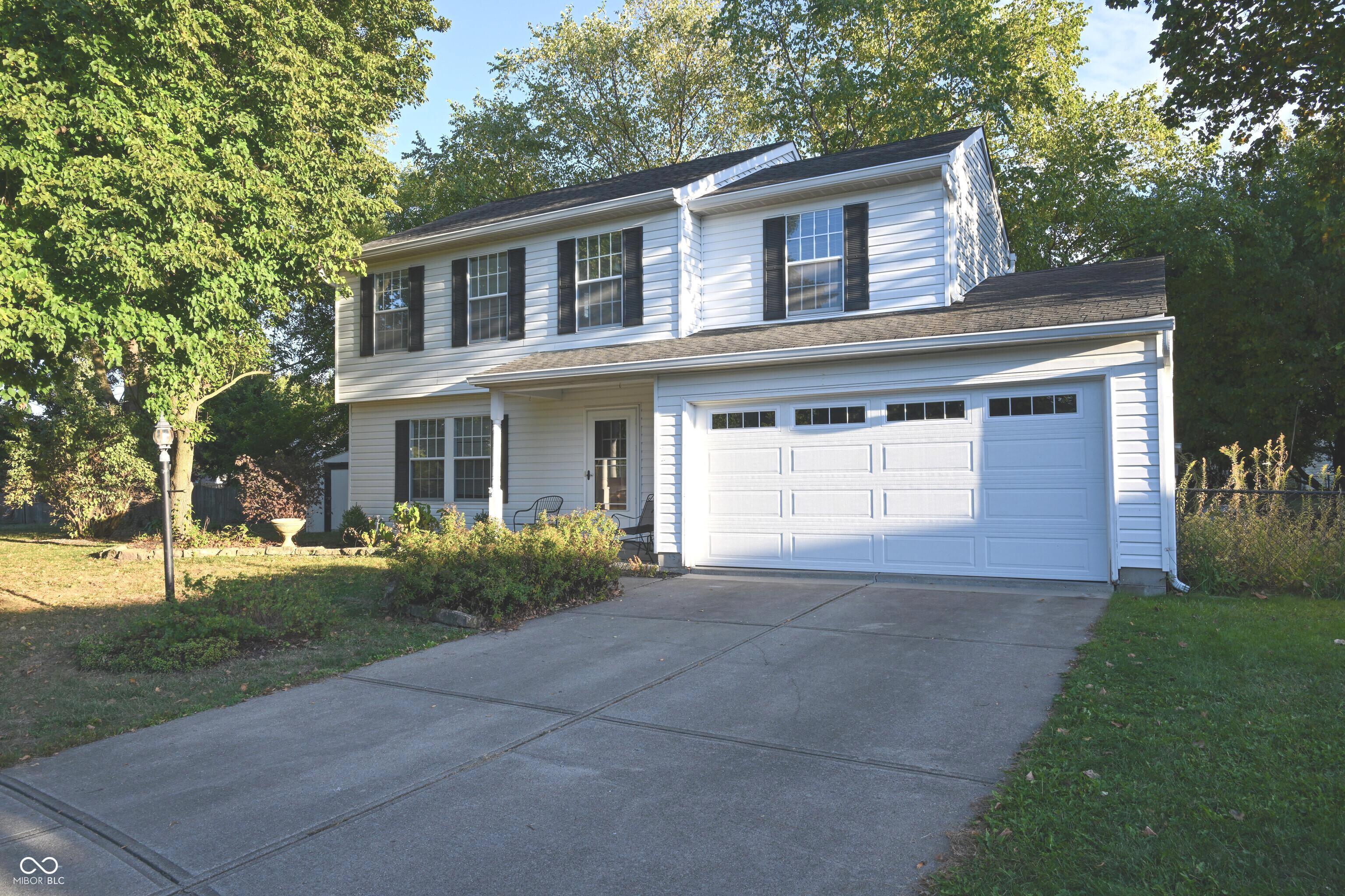 Welcome to your new home, centrally located in Fishers within walking distance to Nickel Plate Trail, Holland Park, and the Fishers Library. The spacious, fenced cul-de-sac lot features mature trees throughout the property. There is convenient access to shopping and entertainment venues located nearby. This home lies within the New Britton Elementary, Riverside Intermediate, Riverside Jr. High, and Fishers High School districts.  An 8' x 10' yard shed provides additional storage for yard tools, allowing you to maximize space in the two-car garage. The main level is highlighted by engineered hardwood flooring and offers two distinct living areas as well as a formal dining room. The kitchen has been recently updated with modern cabinets and granite countertops, and includes a brand new Frigidaire refrigerator. The large deck offers a comfortable outdoor relaxation space. The interior is freshly painted throughout, and the upstairs full guest bath has also been recently renovated. Carpets have been professionally cleaned for move-in readiness. Additional updates include a new AC condenser that was replaced in August 2025 and HVAC replacement completed in 2011. This property presents an excellent opportunity in Hamilton County.      Don't let this one get away! Schedule your showing today!