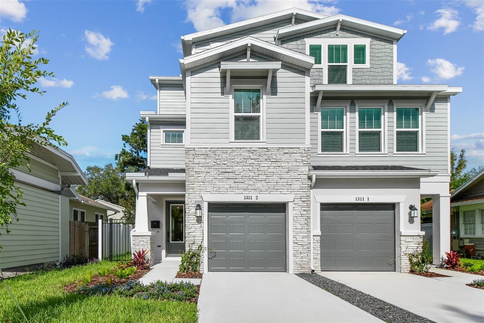 Beautifully designed 3-story townhome in the heart of SOHO, only a short 0.3-mile stroll to the waterfront sidewalk of Bayshore Boulevard and 2 ½ miles to downtown giving amazing dining options and plenty of activities from exercise, shopping or entertainment.
As you approach this home, you will quickly notice the curb appeal.  Varied elevations of roof line, window placement, textures and colors really make this home stand out.  This home includes a fenced in yard with over 1300sf to create your own outdoor sanctuary.
This fee-simple ownership townhome has no HOA fees, giving you freedom and flexibility. Inside, the design team has truly outdone themselves, blending warm maple and white tones with sleek matte black hardware and finishes throughout. The open and airy kitchen is a very aesthetic, featuring a white farm sink, decorative backsplash, quartz countertops, and an open floor plan ideal for entertaining and everyday family living.
The second floor boasts an oversized primary suite privately tucked into the center of the space Natural light fills the primary bathroom and includes not ONE but TWO walk in closets!  An additional en-suite bedroom on the opposite side of the floor offers privacy and comfort for guests or family members. Natural light continues to pour through the stairwells, which are lined with oversized windows and feature rev-wood laminate flooring that flows throughout the home.
The third floor is designed with many options for your living preference.   It includes two additional bedrooms, a bonus room, and a full bath—perfect for a home office, playroom, gym, or guest space.
A few extras…no flood insurance required, gutters, and a refrigerator included and is zoned for the highly sought-after Mitchell, Wilson, and Plant school district.  This home offers peace of mind when you have a reputable builder of almost 50 years backing their warranty.  Come take a tour!