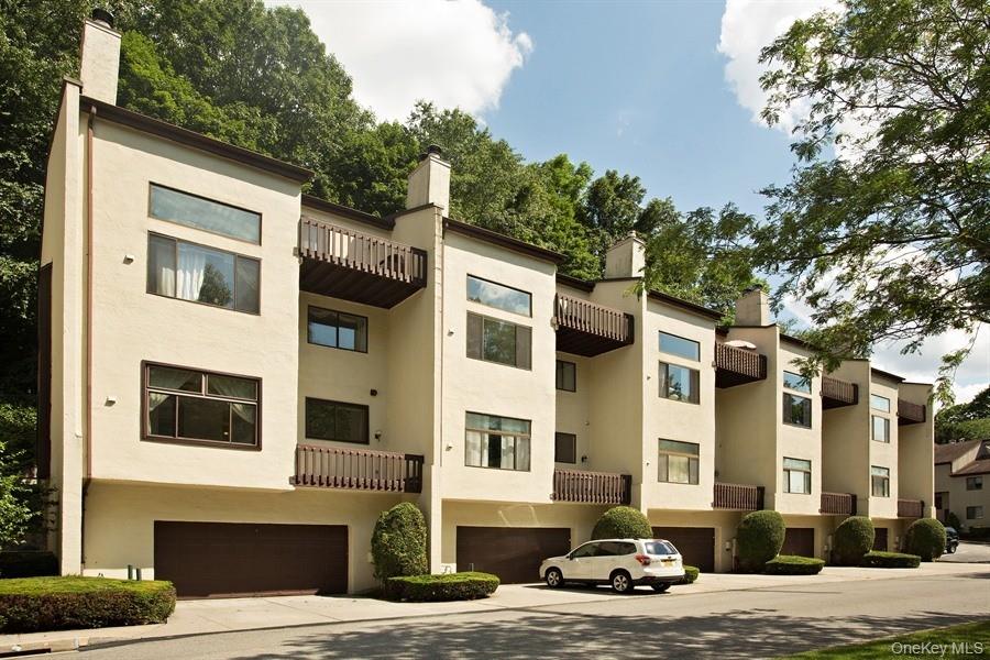 Location, Location, Location! Chestnut Oak Complex. Dramatic and bright townhouse with natural lighting. This 1 bedroom 1.1 bath plus huge Loft/Den is in mint condition. Updated kitchen with stainless-steel appliances. Living room with high ceilings, fireplace and wall of windows is combined with spacious dining area. Updated powder room on the first level. Huge primary bedroom with with two clothes closets and private updated full bath. Loft/Den/Office off primary bedroom with sliding glass door to balcony. This unit comes with one-car garage, newer furnace, hot water heater, refrigerator. Washer and dryer in the unit. Entire interior of the unit was just painted (September 2025). Complex offers, pool, tennis and community garden. Conviently located to Chappaqua train station, shopping, schools, parkways and bus.